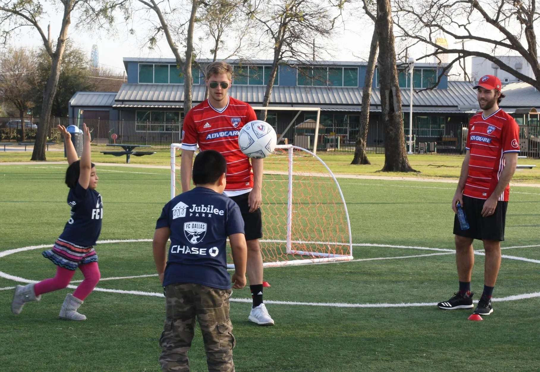 FC Dallas players Walker Zimmerman, Victor Ulloa, Ryan Hollingshead and Kellyn Acosta played soccer with 200 Jubilee students, unveiling thousands of dollars' worth of gear donated by Chase.