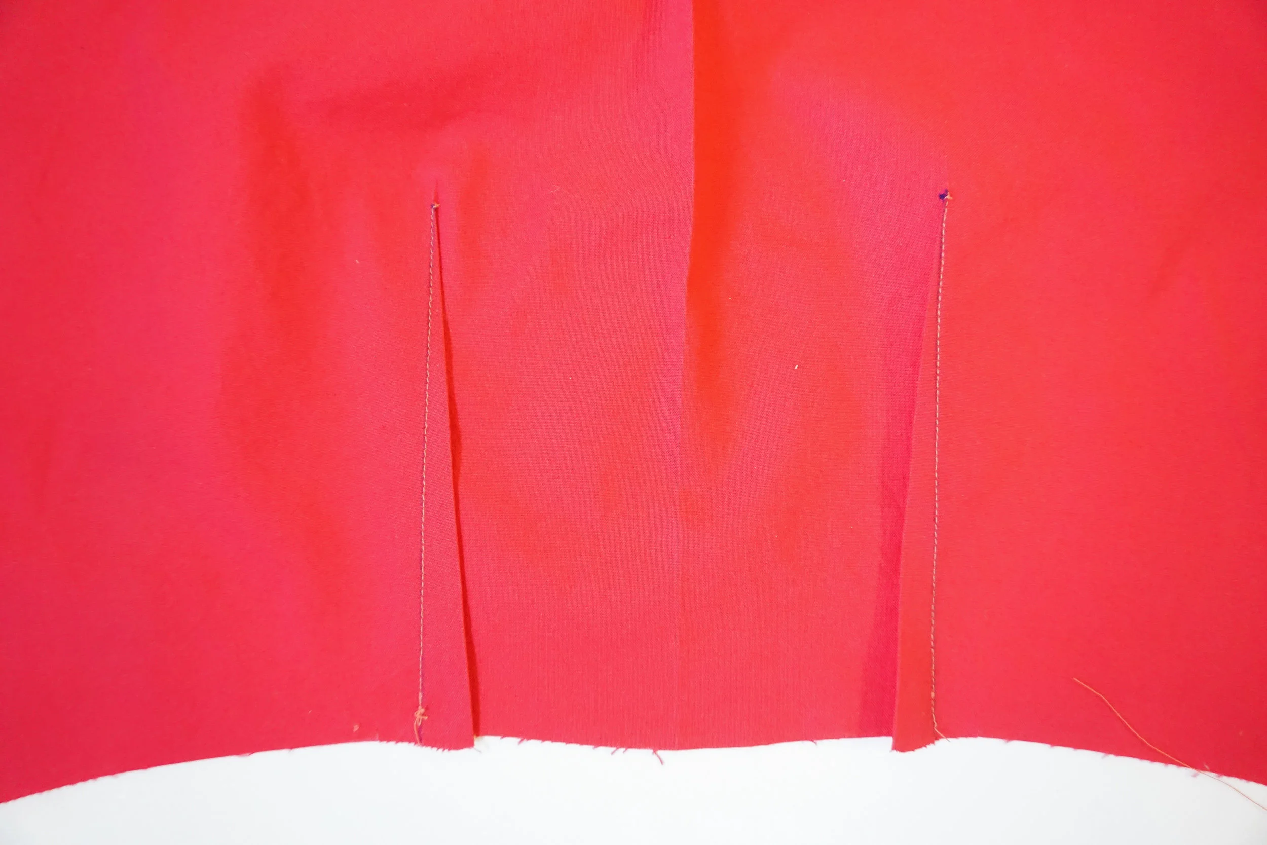 Step 5: Sew the back darts the same way you sewed the front darts. After they are sewn, press the darts toward the center.