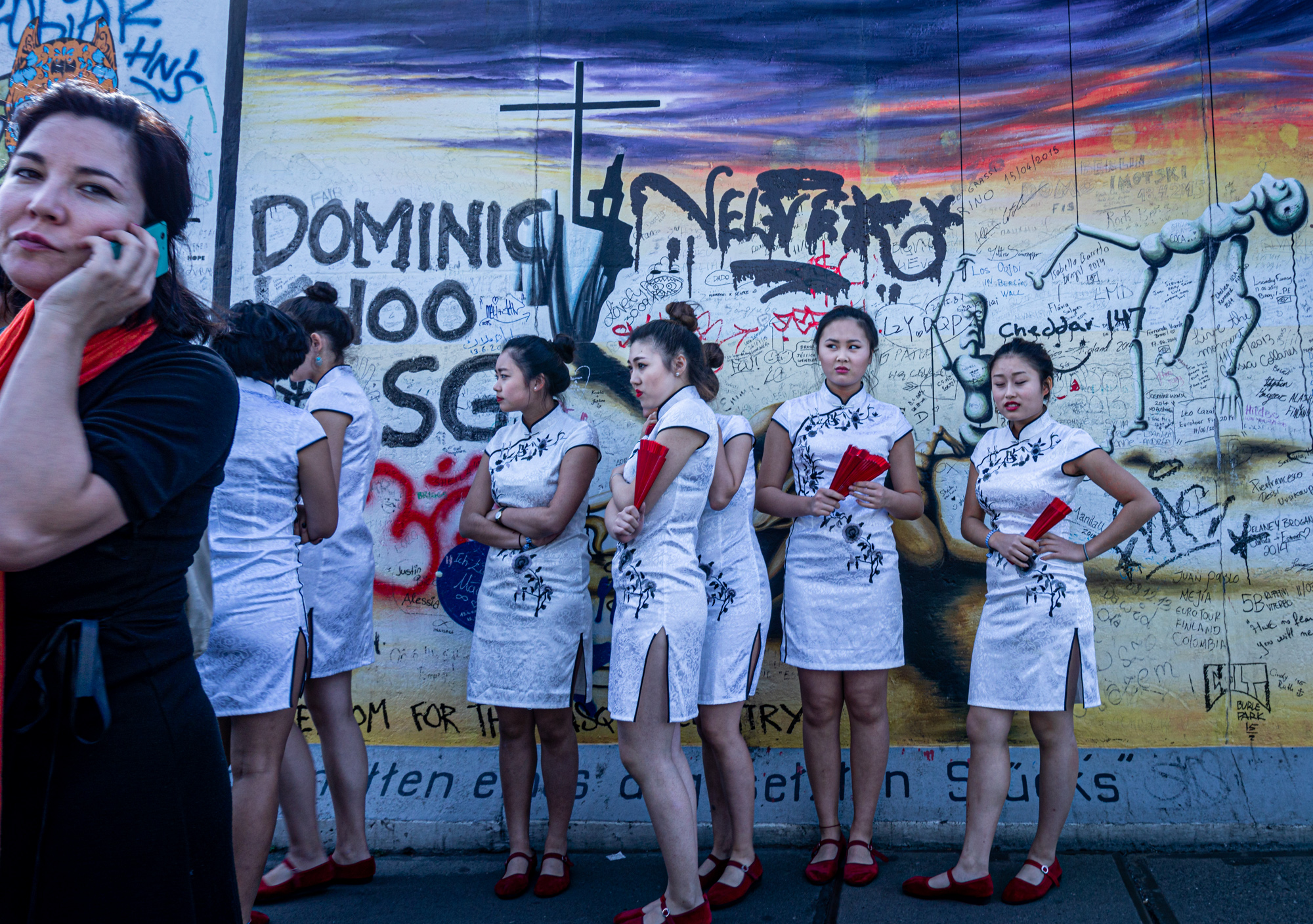 Chinese performers at the Berlin Wall. Berlin, Germany.