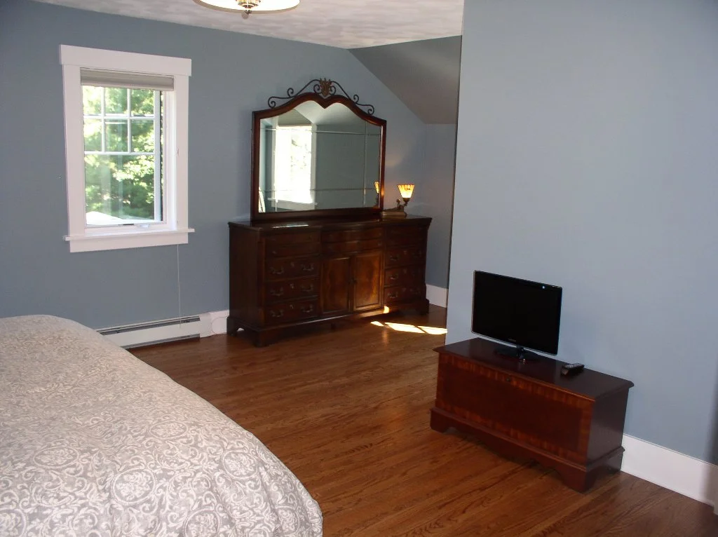 Master bedroom hardwood flors and baseboard heat.