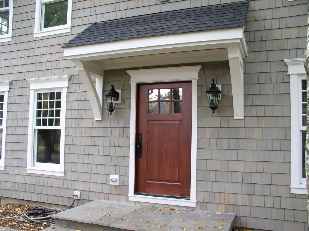 Front door - the added roof protects the mahogany door and visitors from the elements.