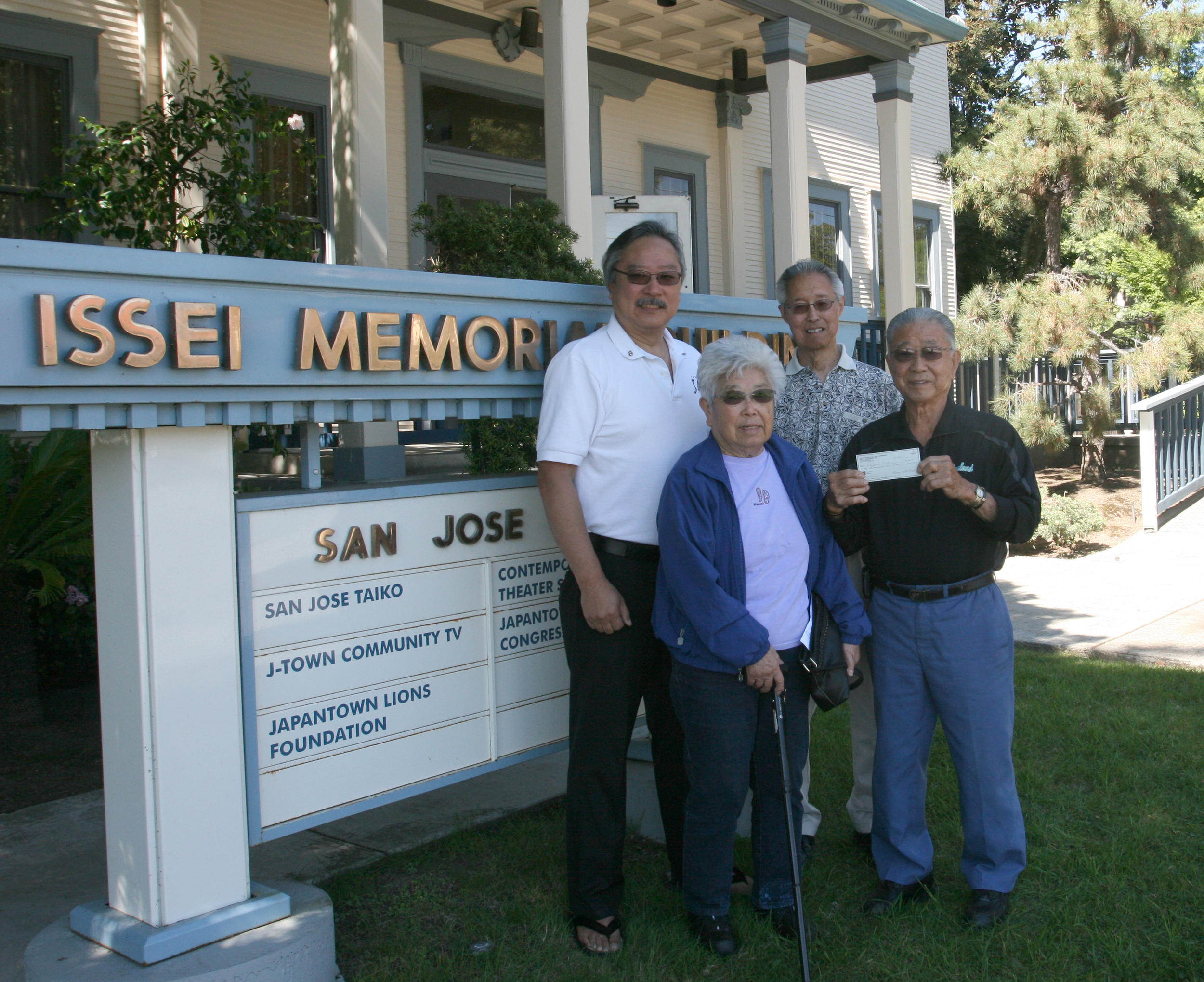 The Matsumotos dropped by the IMB to hand over their donation check. Front row: Lucy Matsumoto and Ray Matsumoto. Back row: Leon Kimura and Tom Oshidari.