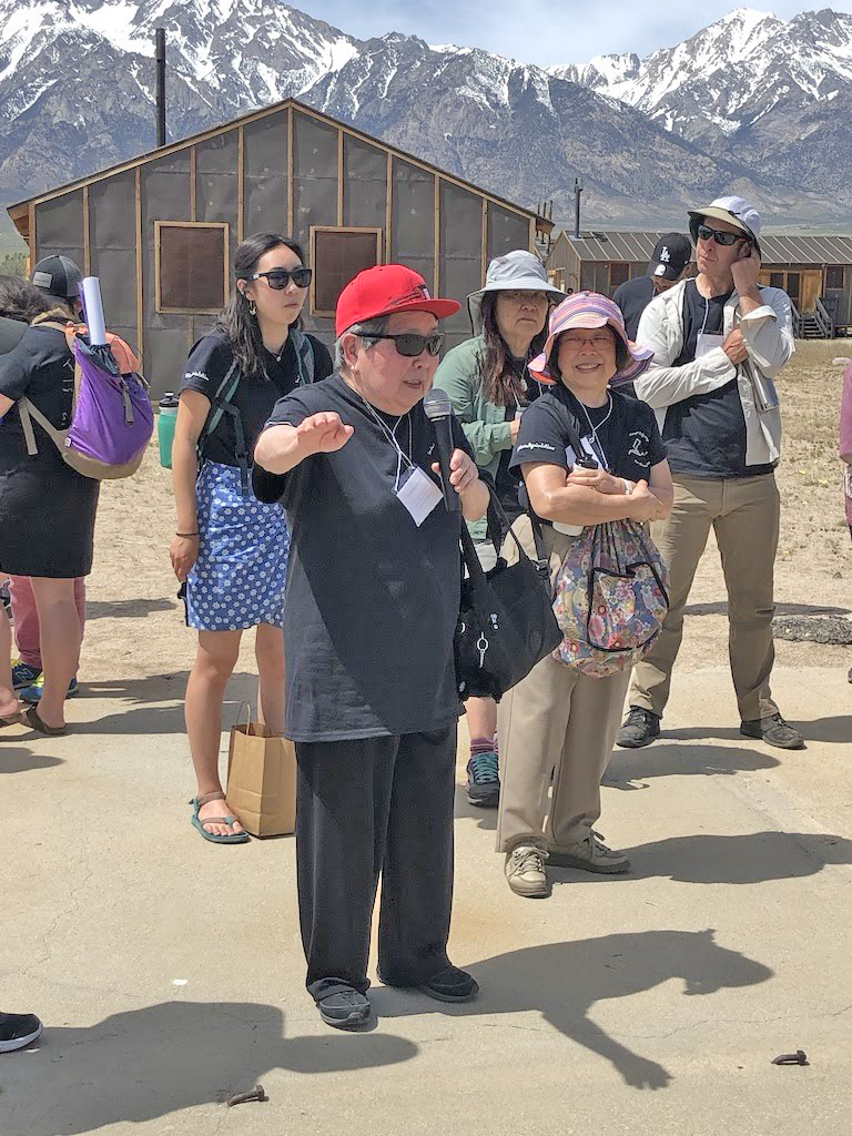 Sally Yonenaga shares stories outside the reconstructed barracks.