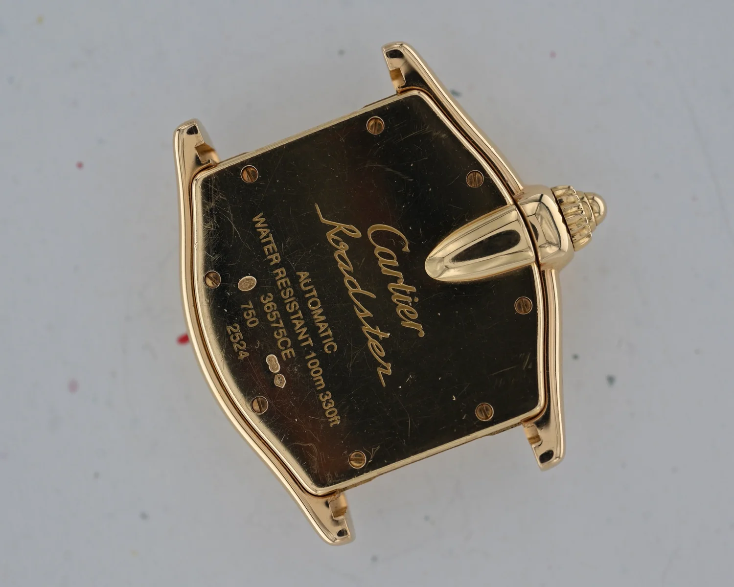 A unique Cartier Roadster Ref. 2524 in Yellow Gold with extra