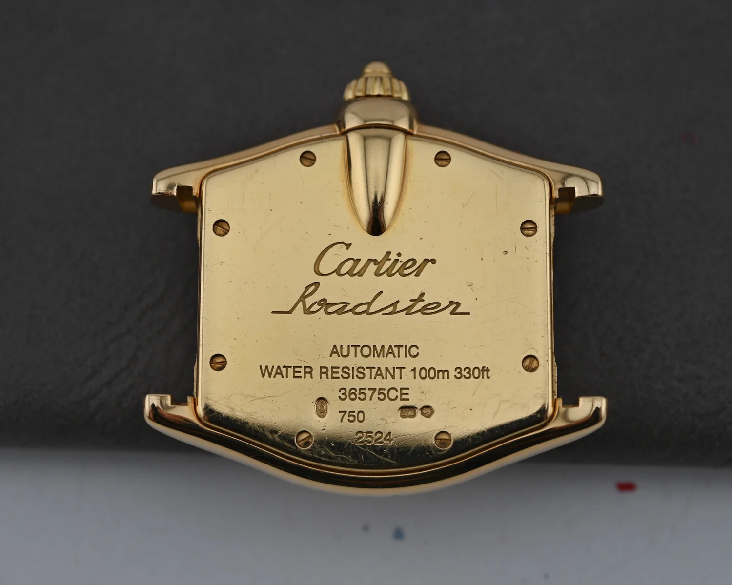 A unique Cartier Roadster Ref. 2524 in Yellow Gold with extra