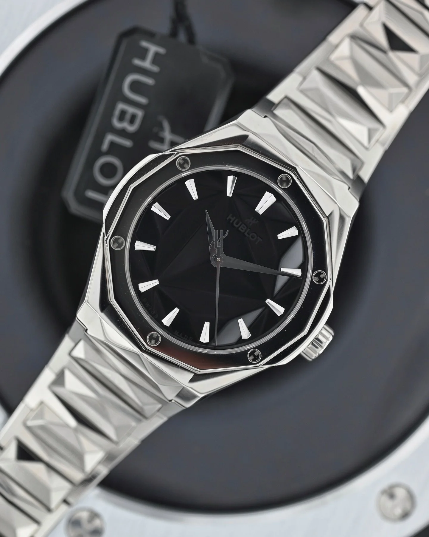 Now Available: Hublot Classic Fusion Orlinski Titanium with boxes and under warranty

This watch is a feast for the senses as your mind tries to figure out how this dial is configured. The sculpted and polished black dial with signatures applied to t