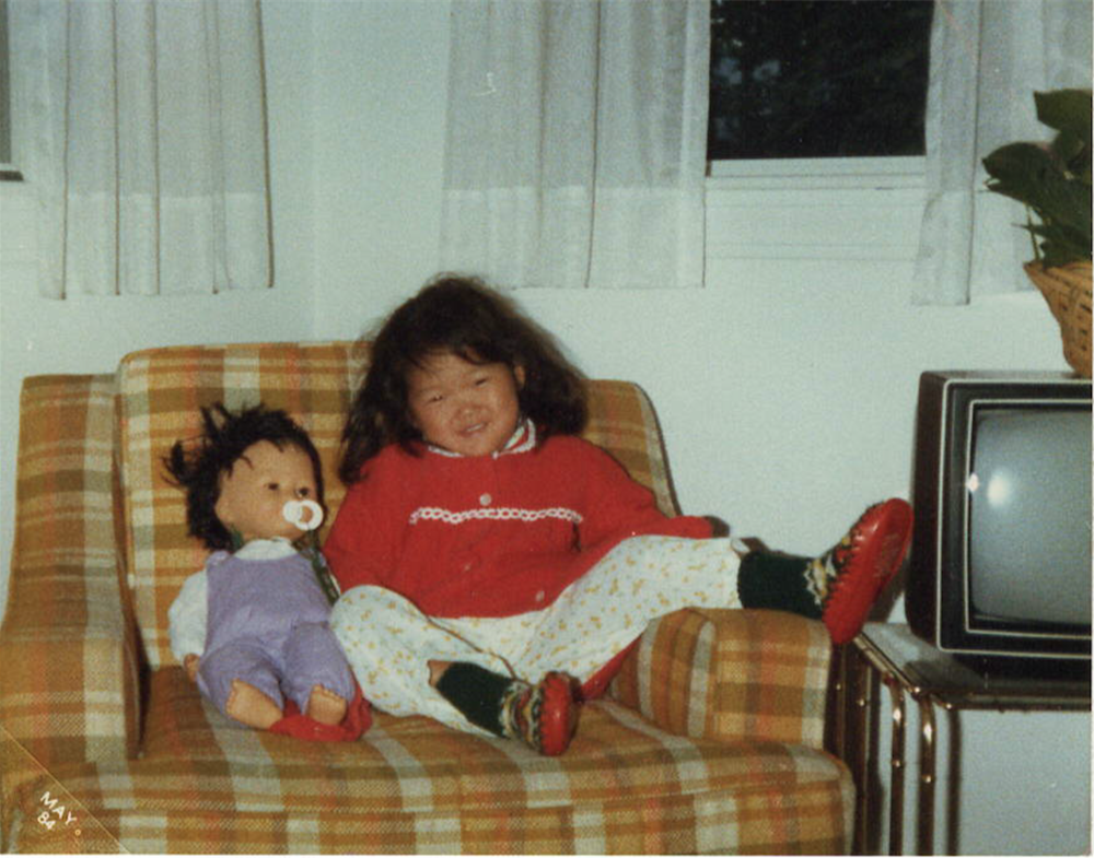  One of my many "looks" I gave the camera. Once my cheeks smiled, my Asian eyes promptly disappeared. My Asian doll was aptly name Korea, after my birth country. Such a lady in that last photo of the triptych, aren't I? &nbsp;Melrose, Massachussetts,