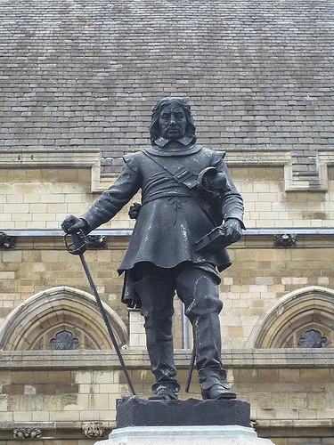 The statue of Oliver Cromwell outside the Houses of Parliament (the Palace of Westminster) in London