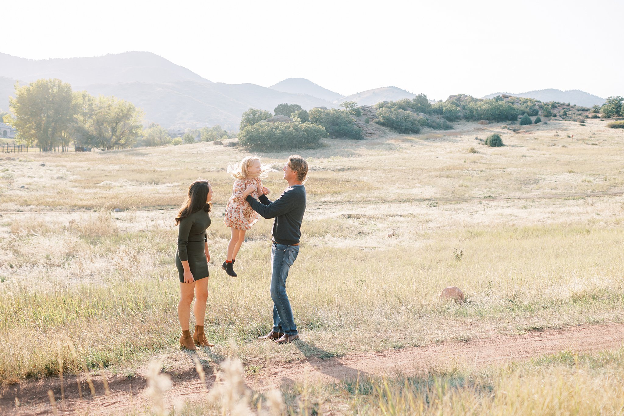 family-with-daughter-in-golden-field.jpg