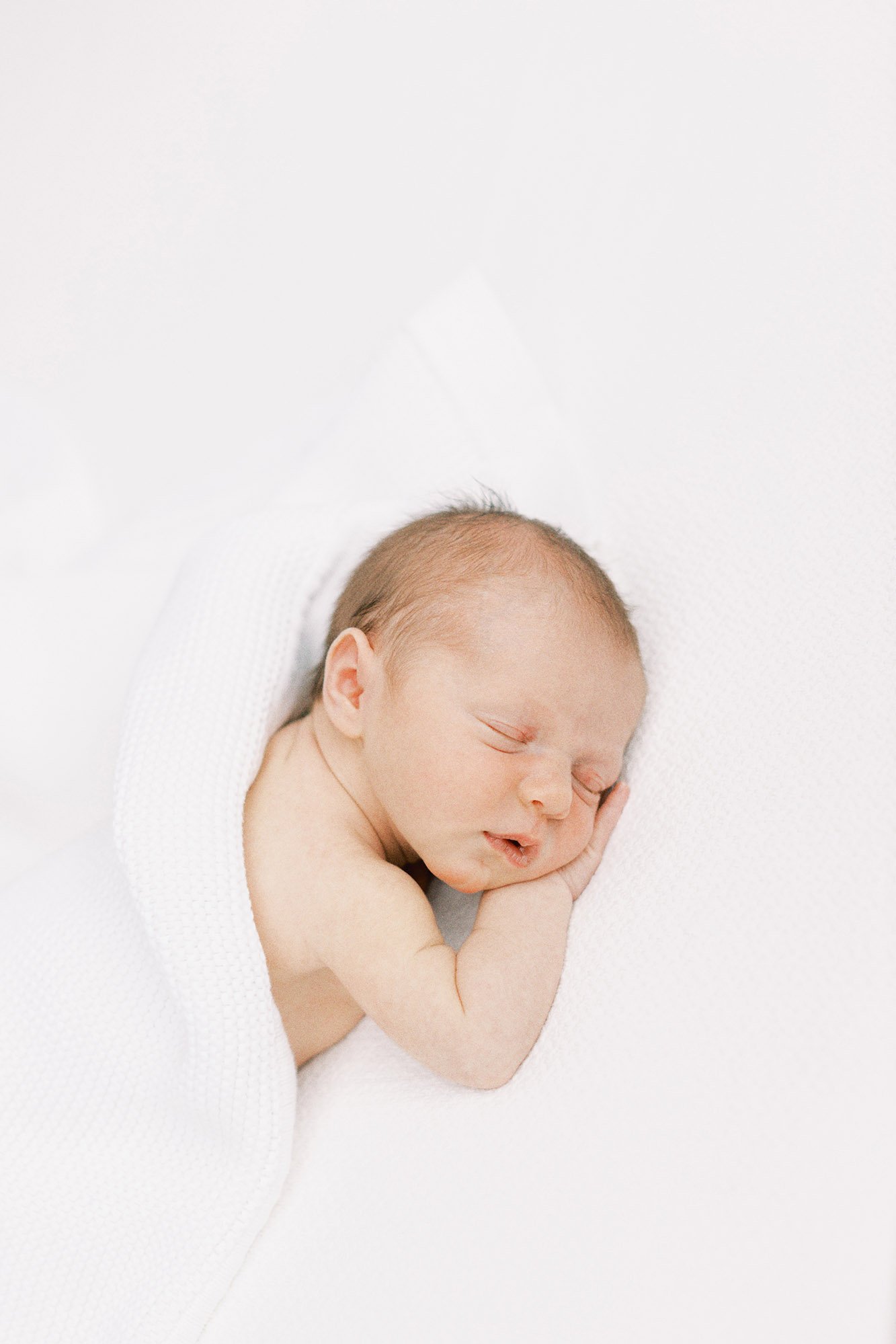 newborn-sleeping-on-tummy.jpg