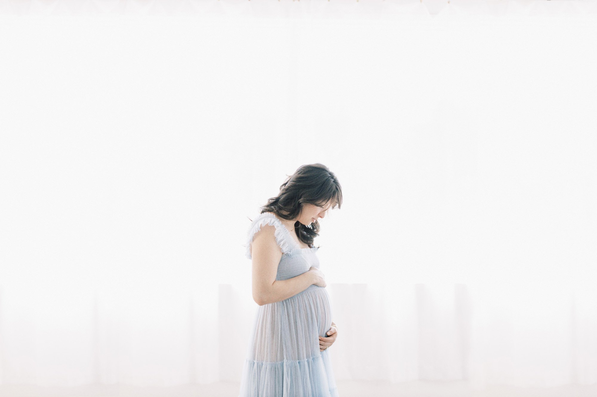 backlit-maternity-in-blue-dress.jpg