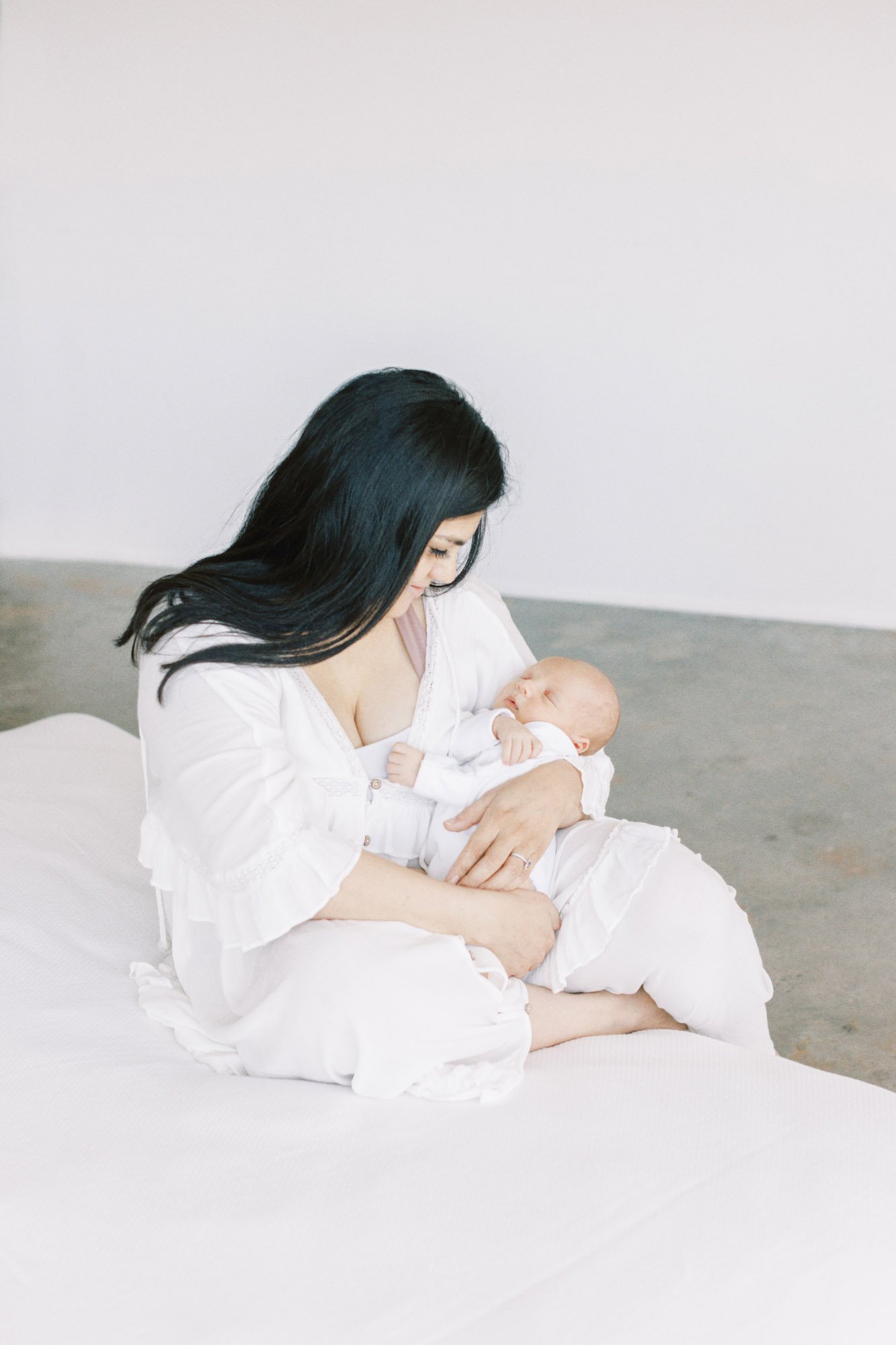 mom-and-baby-on-edge-of-bed.jpg