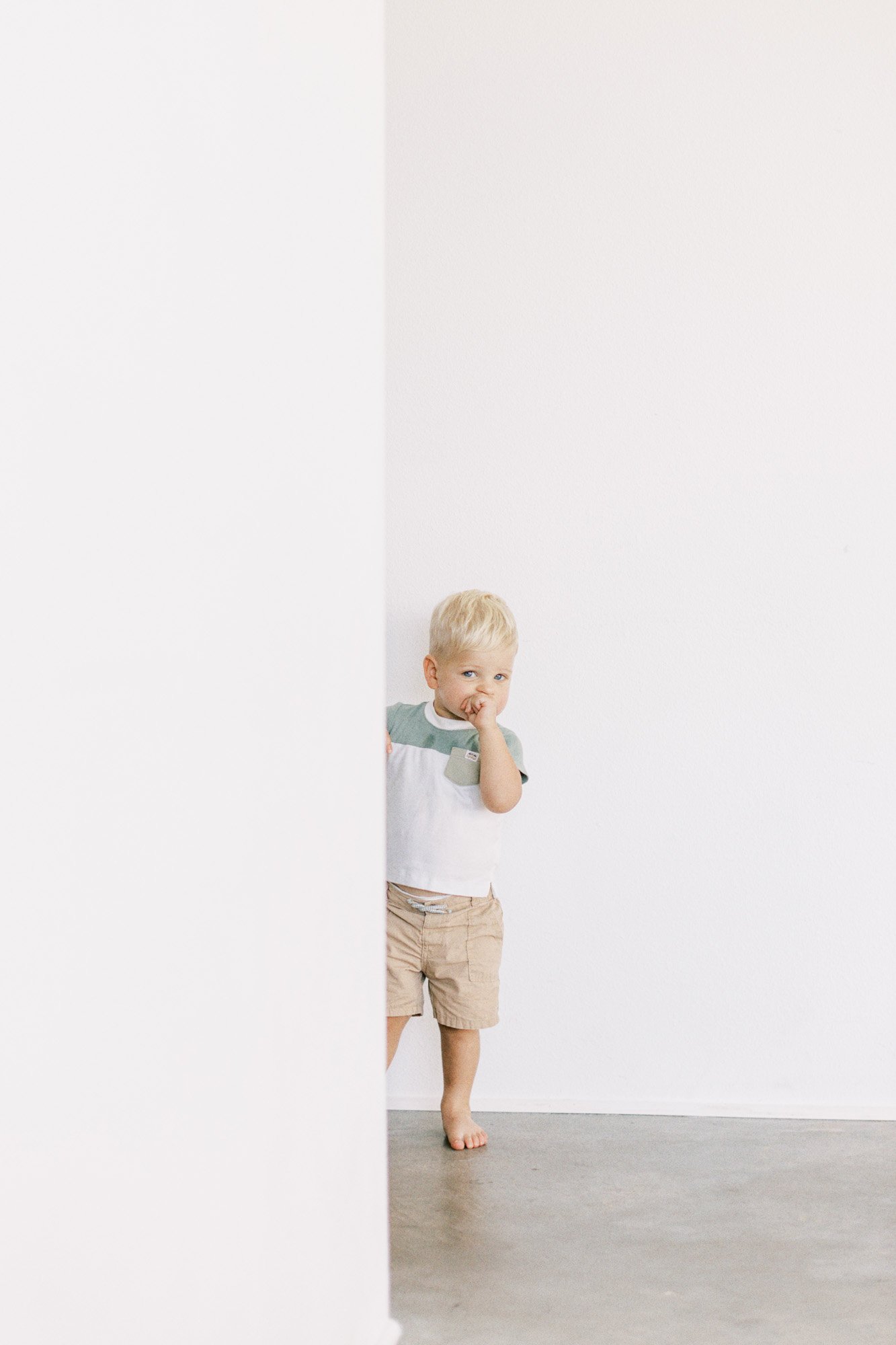 toddler-looking-around-wall.jpg