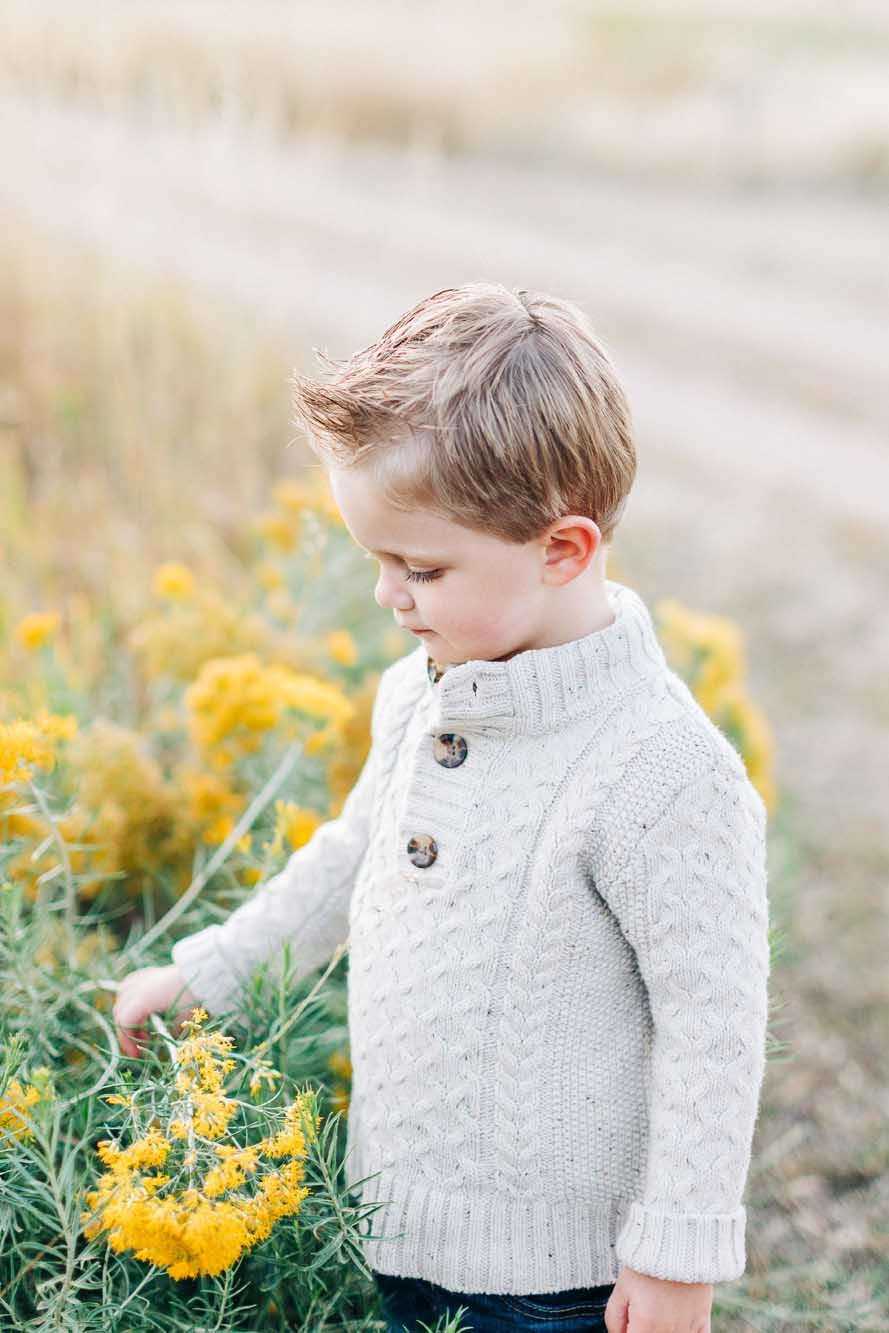 boy-in-sweater-by-flowers.jpg