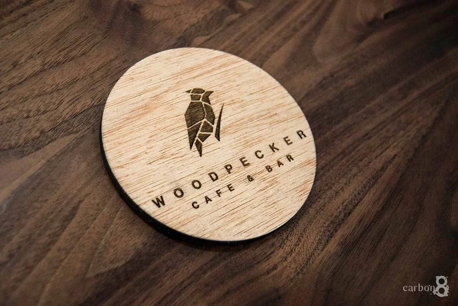Laser cut coaster for Woodpecker Cafe