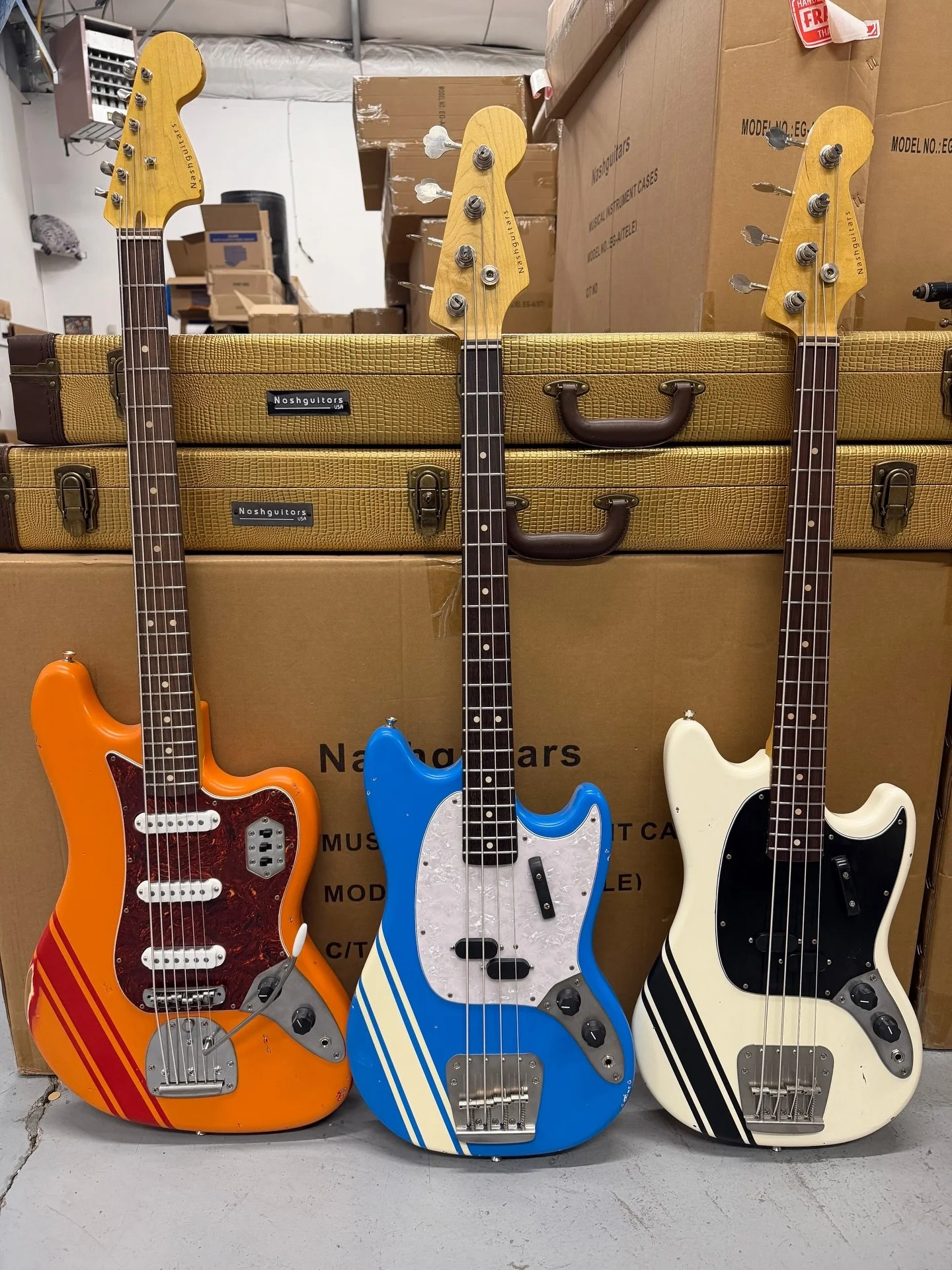 Three Comp Stripe Basses | Arctic White + Maui Blue MB-63 + Orange Sunshine B-6 | Find an Authorized Dealer 🔗 in bio 

#nashguitars #bassguitars #guitarsofinstagram