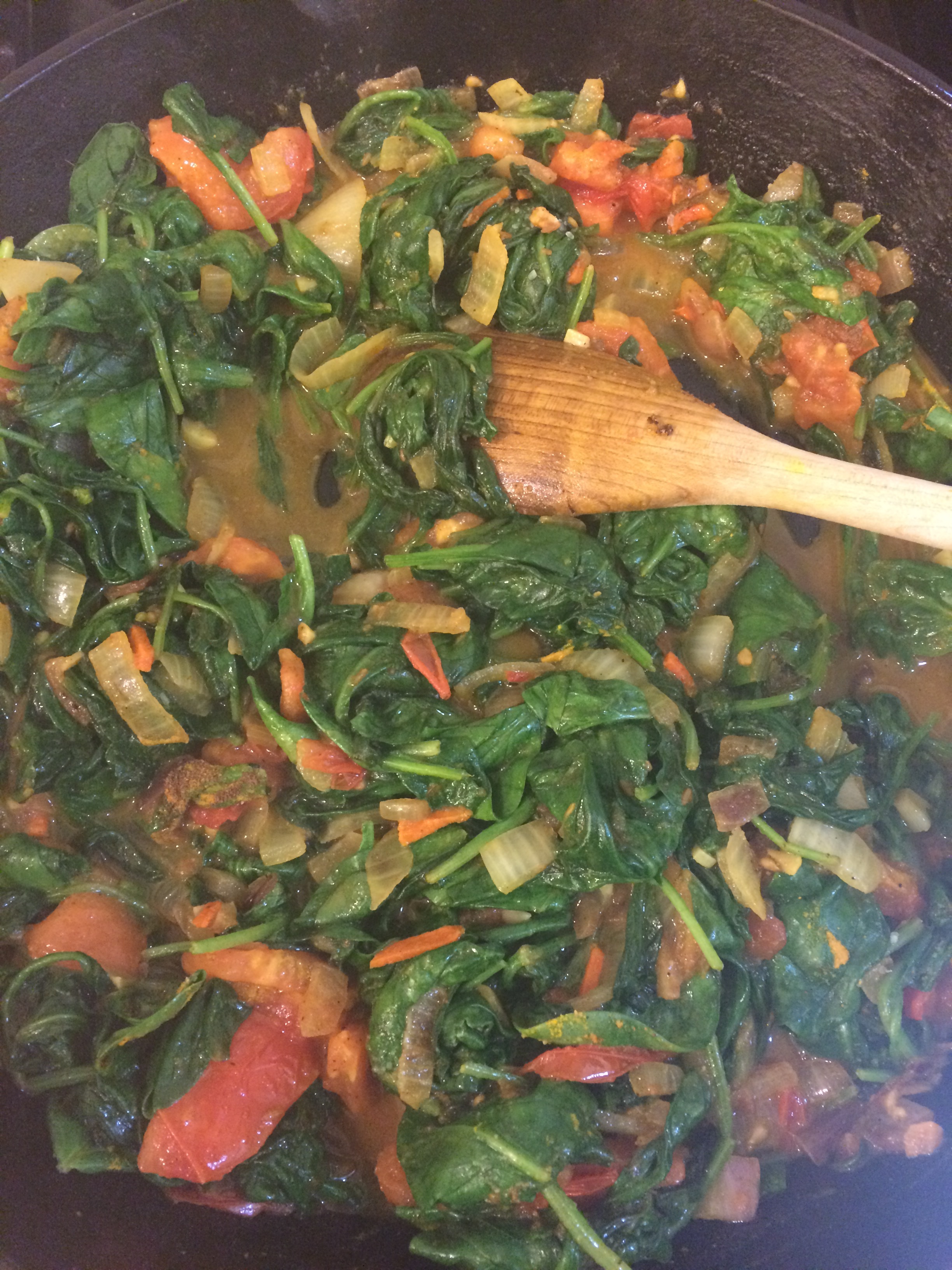 Simmer so that greens wilt