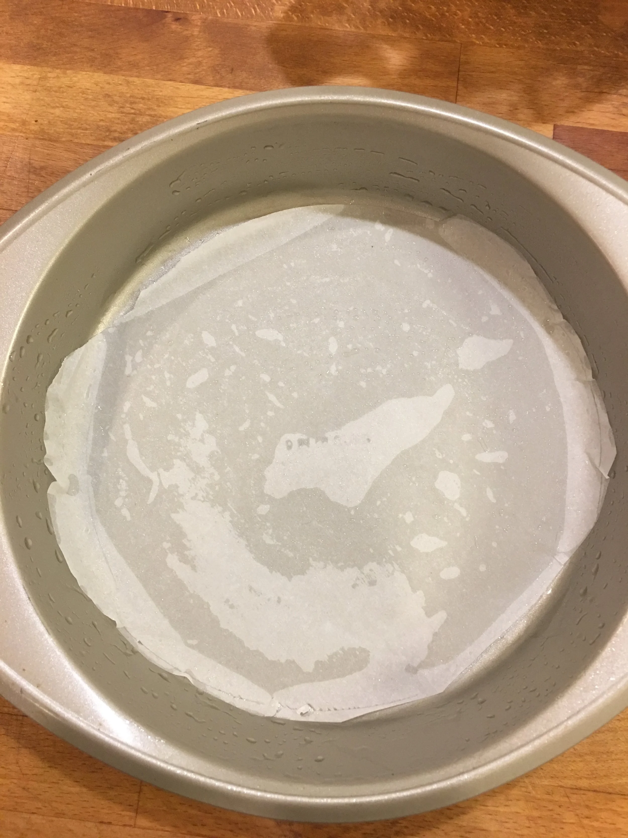 I was sloppy with my cutting. I didn't want to draw on the paper, but it was actually helpful to have the paper go past the bottom crease of the pan.