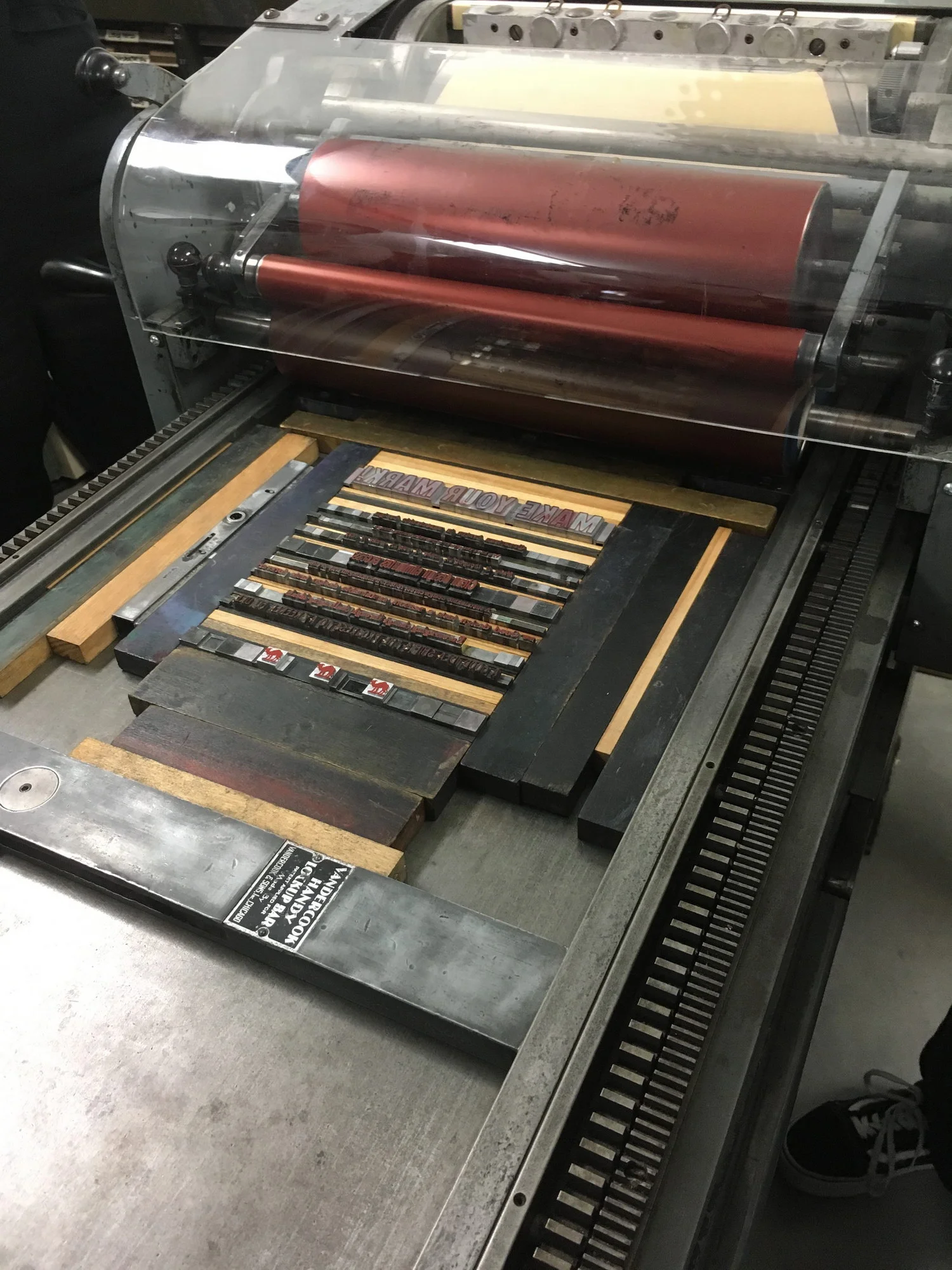 Lines of text assembled on the Vandercook proofing press.