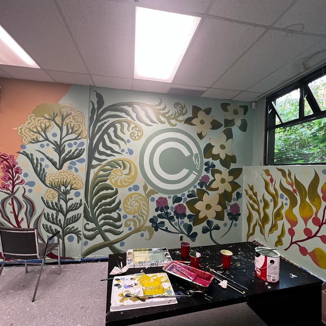RePost &bull; @freya.emery Back in August I painted my 5th mural, this time with friends! @percifax, @chellelussi, and I painted a huge mural in the @capilano.courier&rsquo;s office! We highlighted the signature &ldquo;pushing buttons&rdquo; logo, su