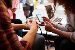 stock-photo-closely-image-of-woman-is-making-an-on-line-purchase-via-cell-telephone-while-is-sitting-with-427841167.jpg