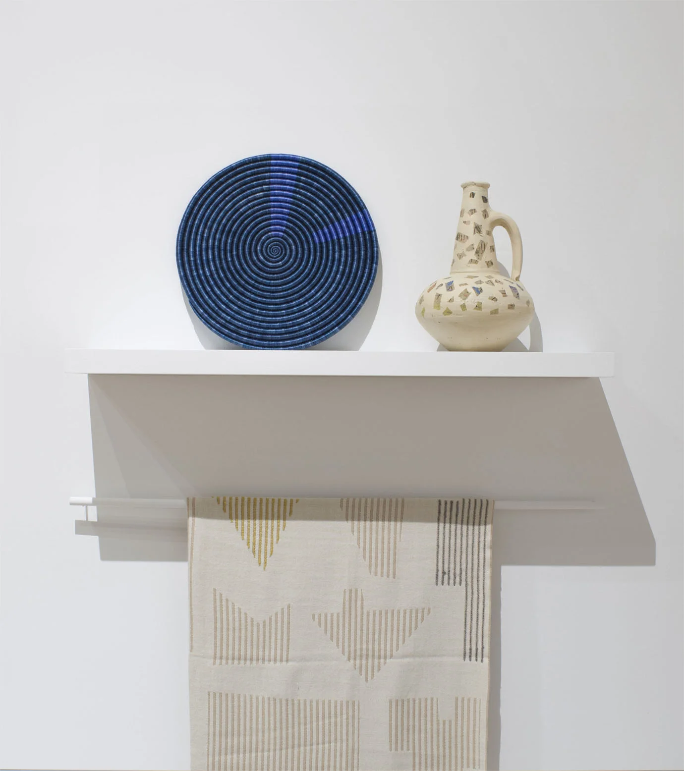Woven platter (one of a kind), custom vase (one of a kind) and Houses Throw with Hawkins New York