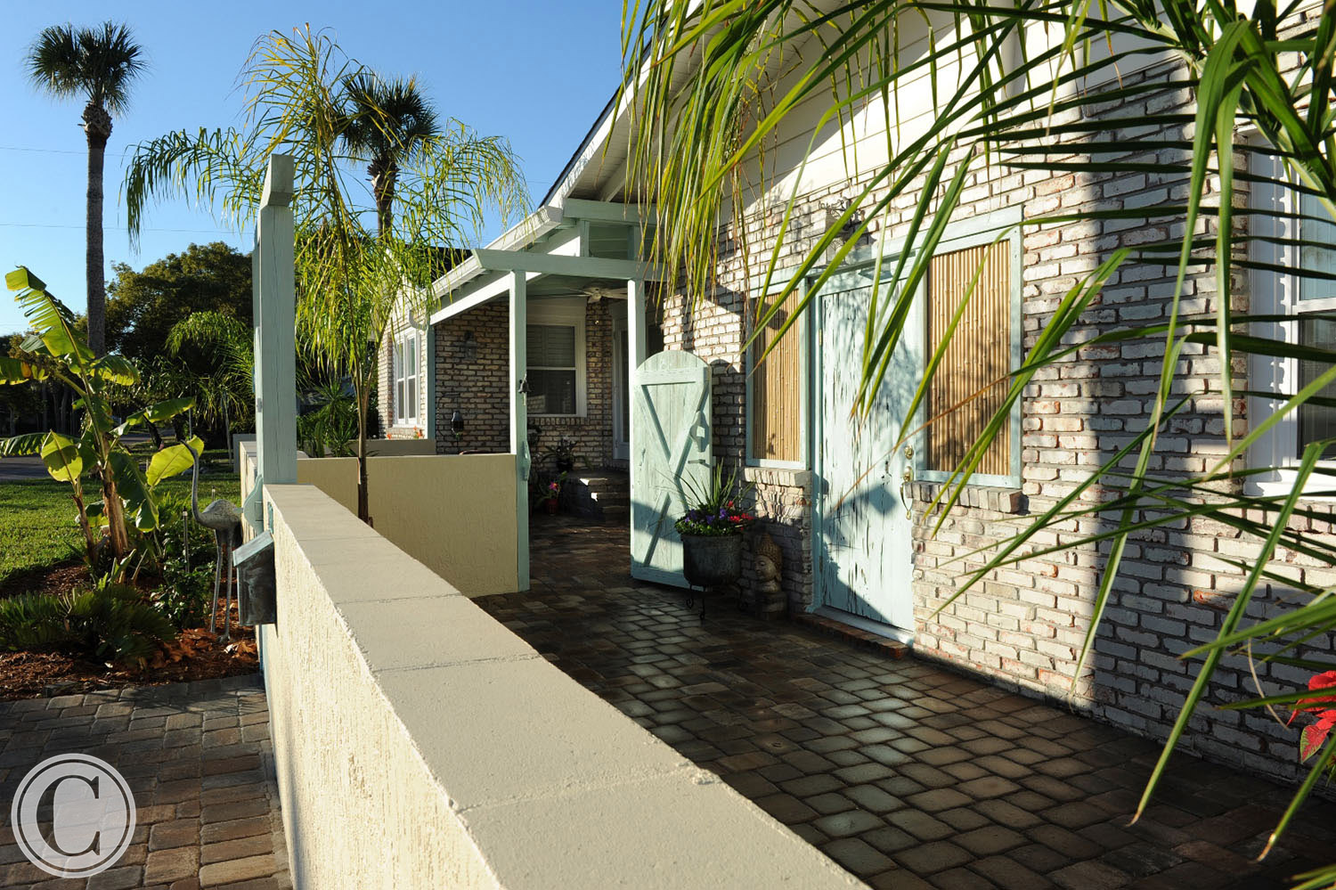 Design-build remodel in Neptune Beach, FL included interior and exterior elements. The homeowner requested that the exterior have a “more island-Balinese look.” ©Mark Sain Wilson Photography