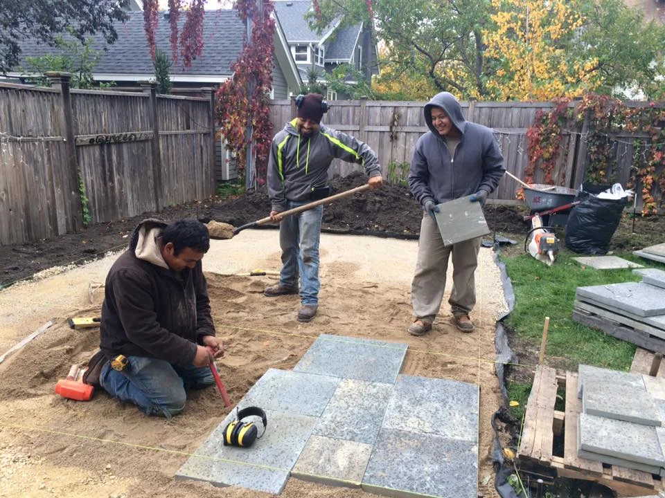 laying down the under lay beneath the bluestone patio.jpg