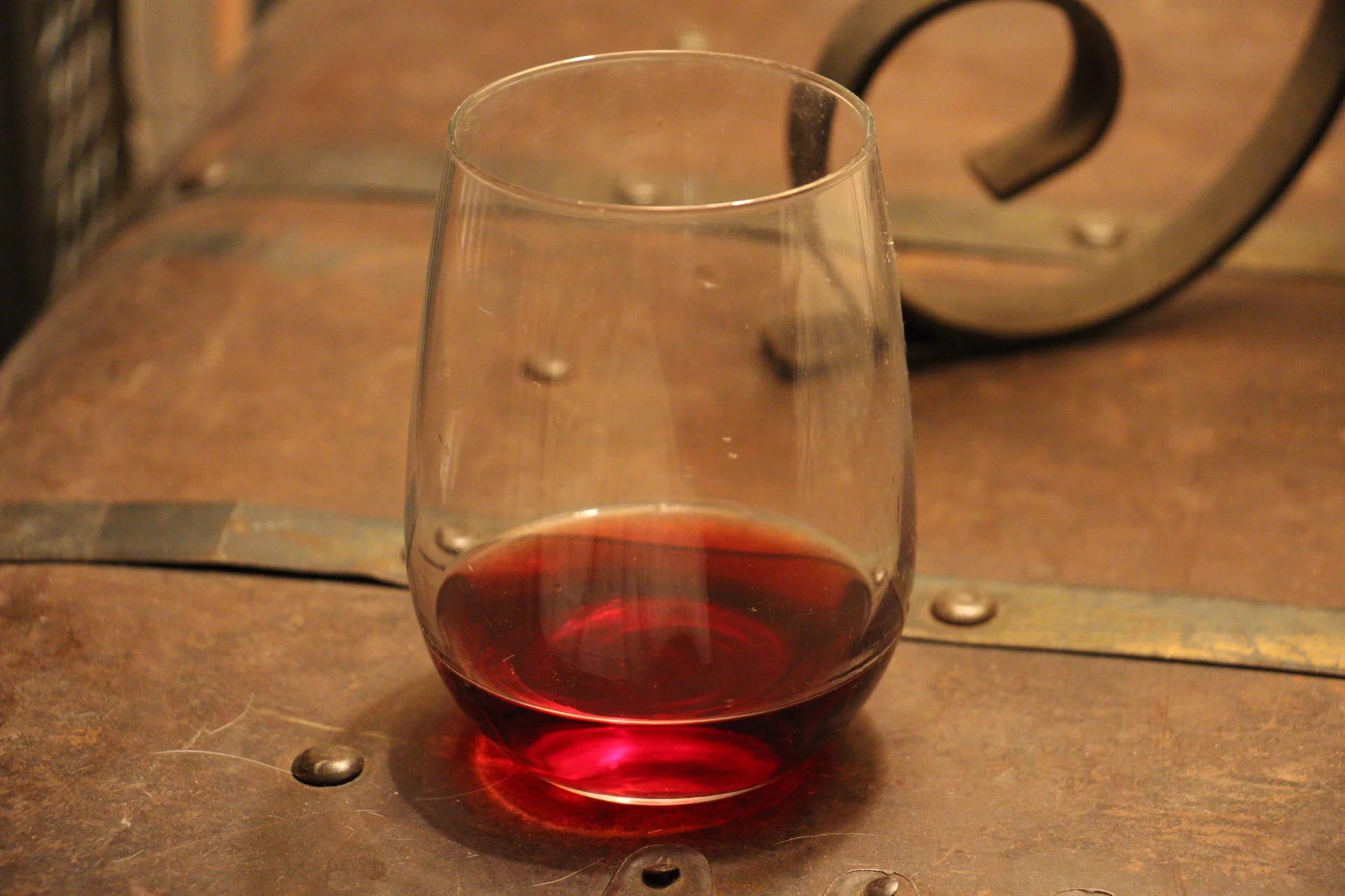 Sorry about the yellowness of this photo. I lost the light before I could get this sucker in a glass, so the lamp had to suffice. I understand this doesn't really help you see the true color of the wine. But at least you can see how almost-transparent it is, right??