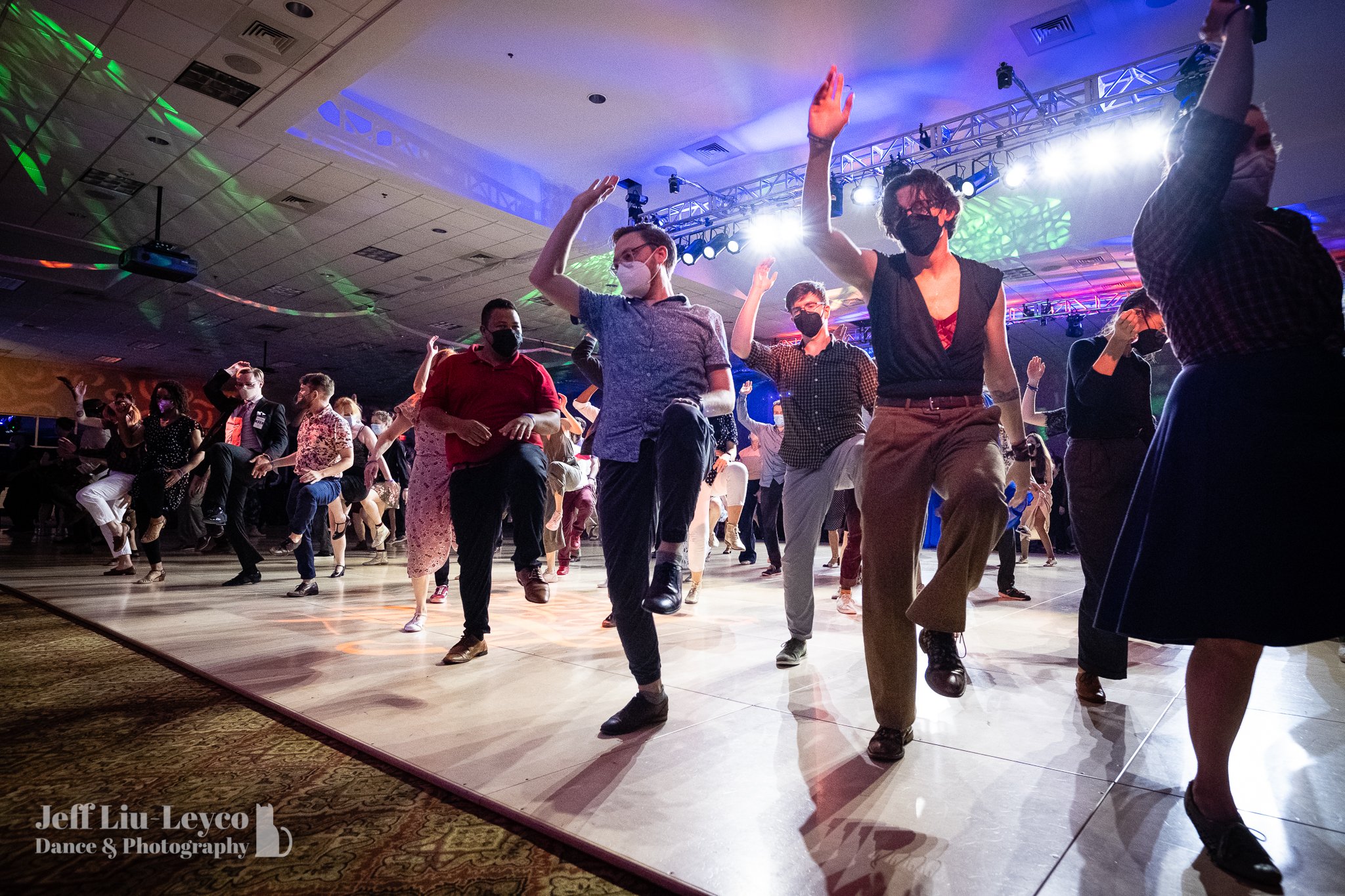  A crowd of dancers socially perform the Tranky Doo line dance in Expo.  