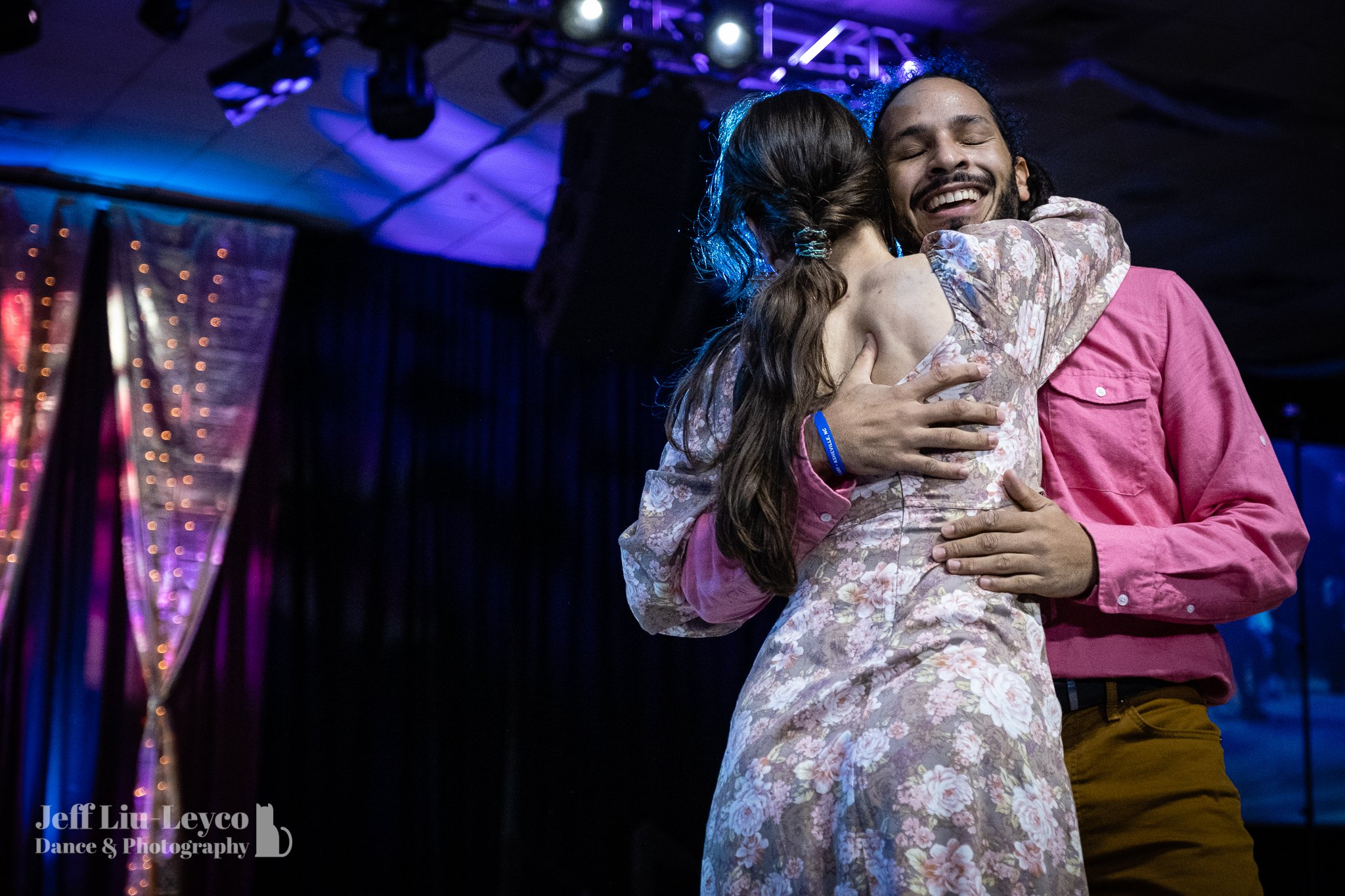  Two dancers hug after competing in the Pro-Am in Expo. 