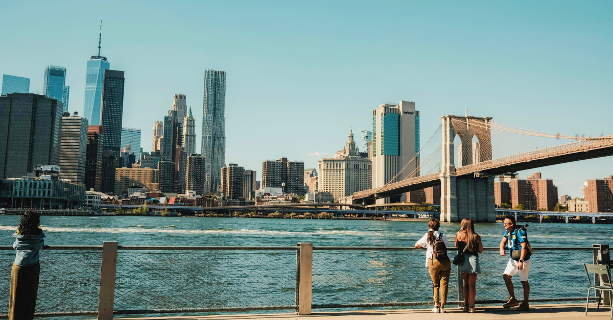 Family with teen looking at the NYC skyline