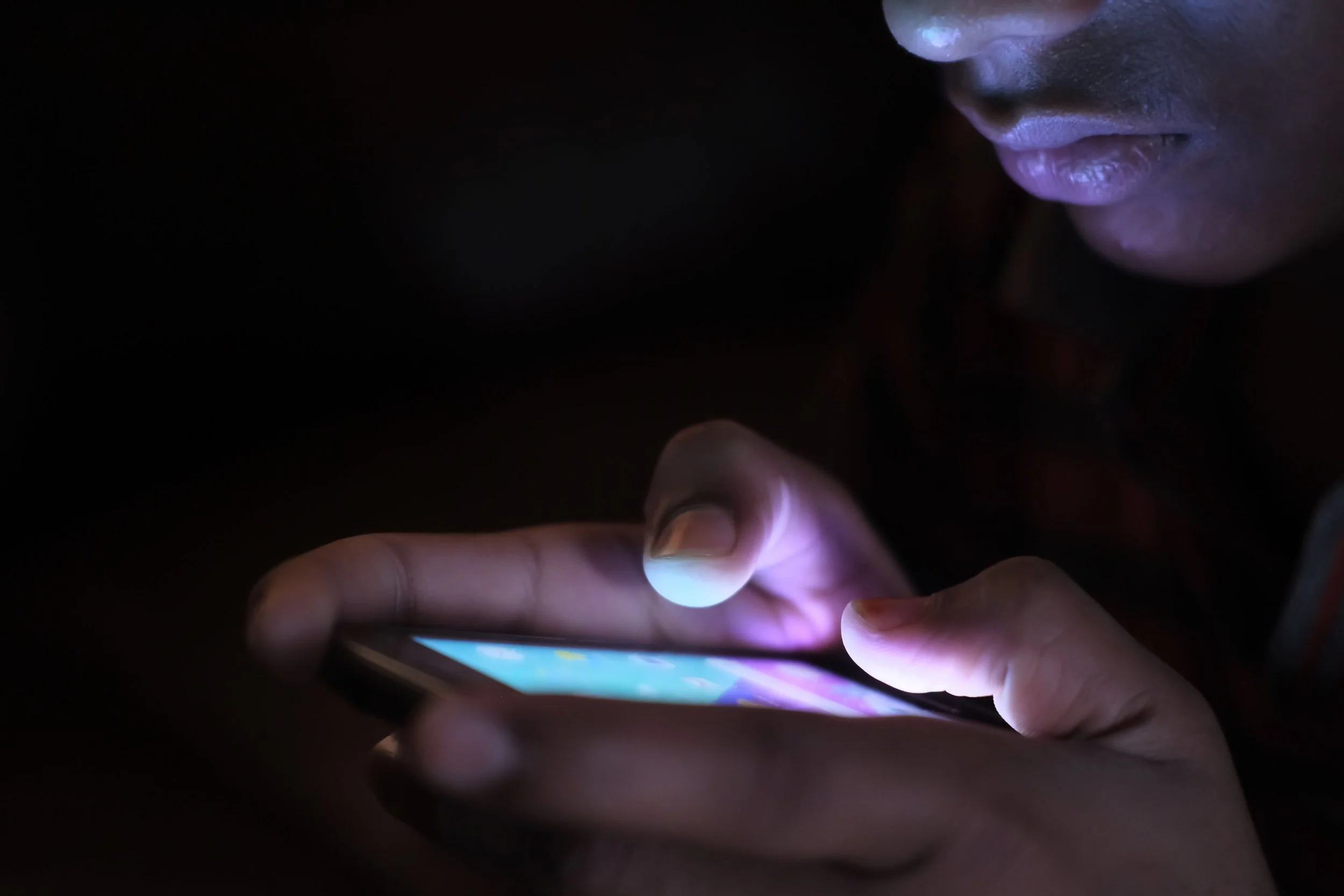 Teen on phone at night