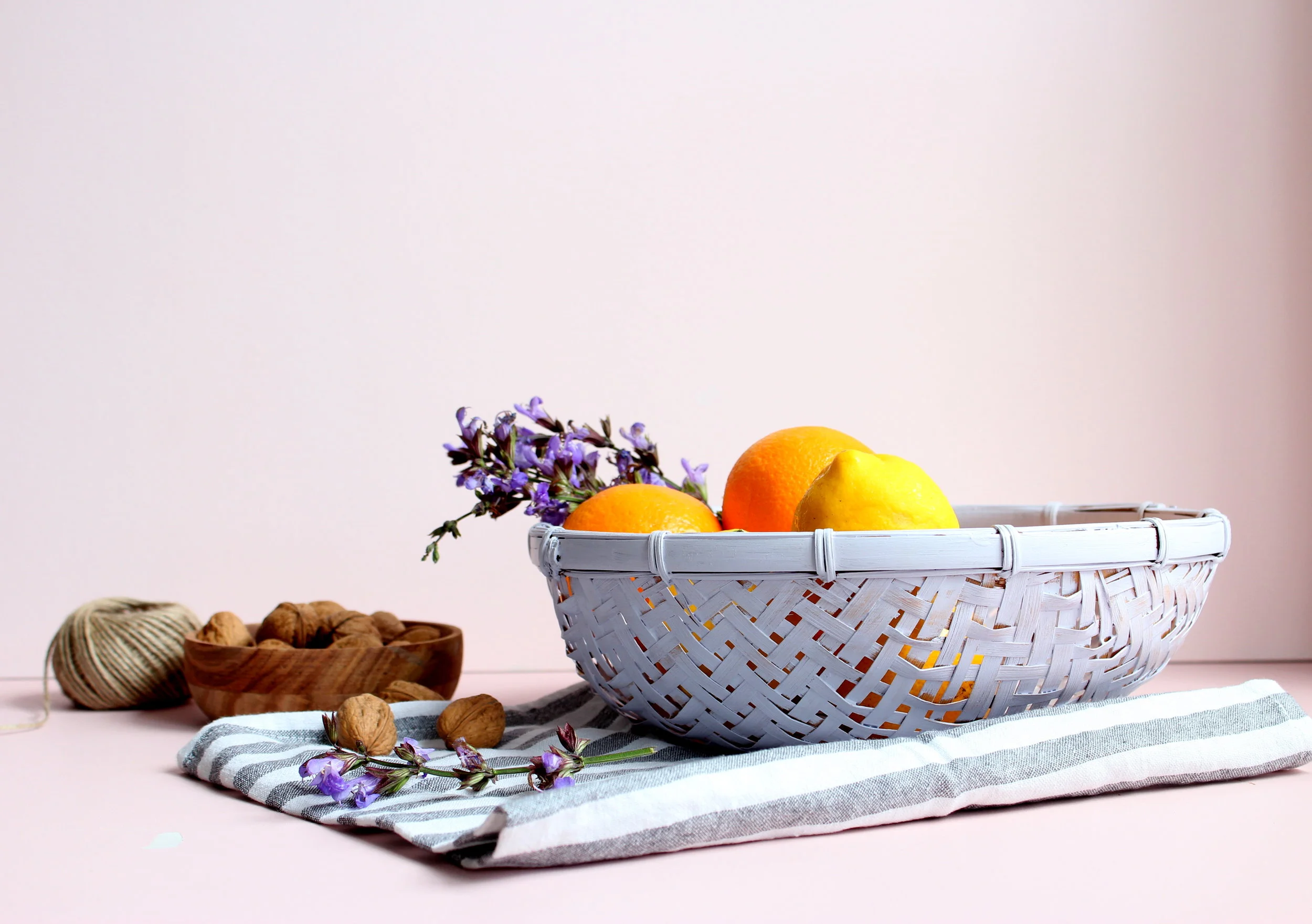 An old wicker basket looking fresh with a new coat of paint