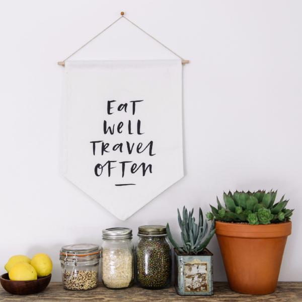 In the Daylight - 'Eat Well Travel Often' Wall Flag