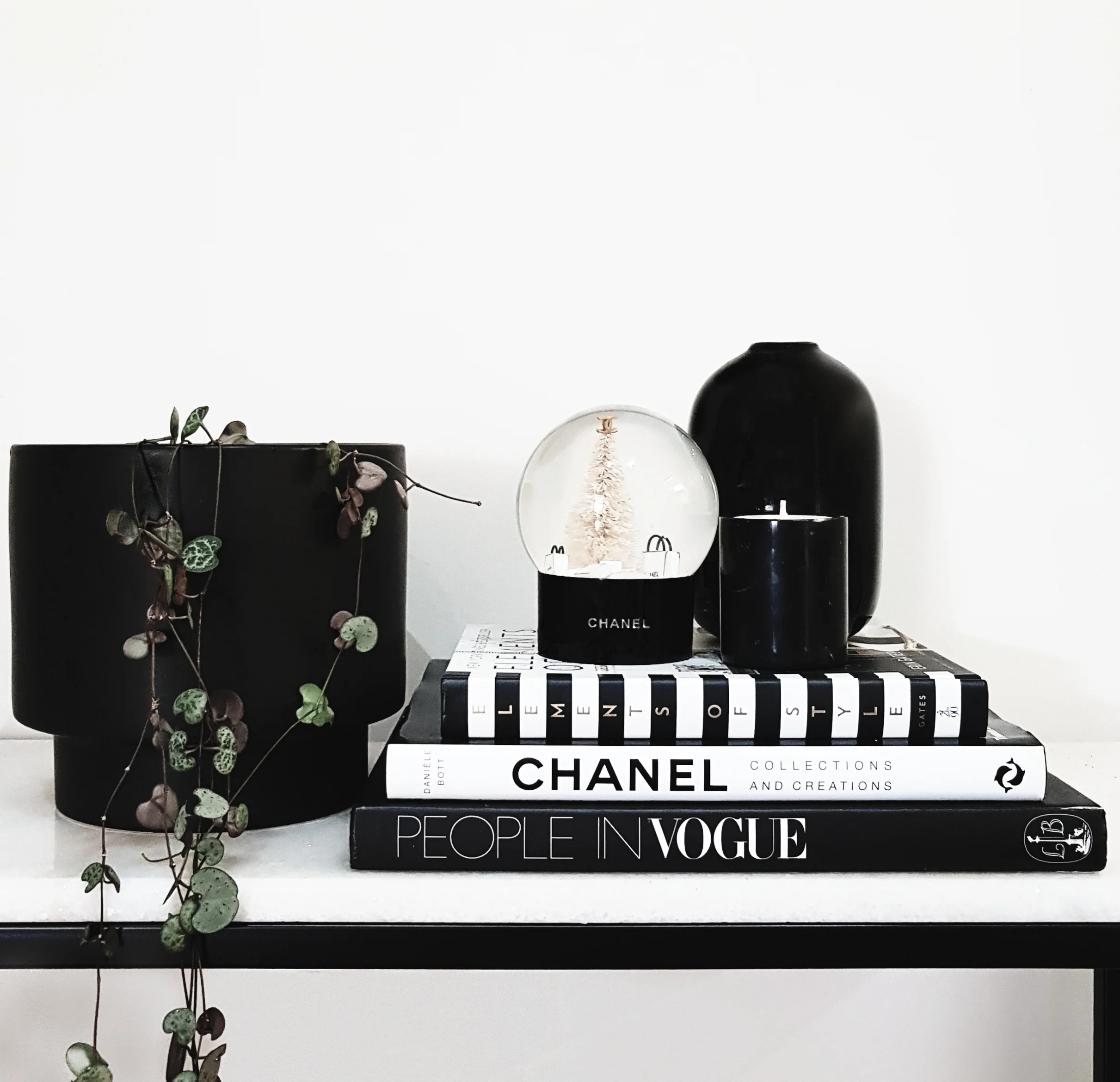 Use pieces that reflect your personality & style. I absolutely love this Chanel snowglobe & gorgeous black marble candle from Burn Baby Burn Candle Co.