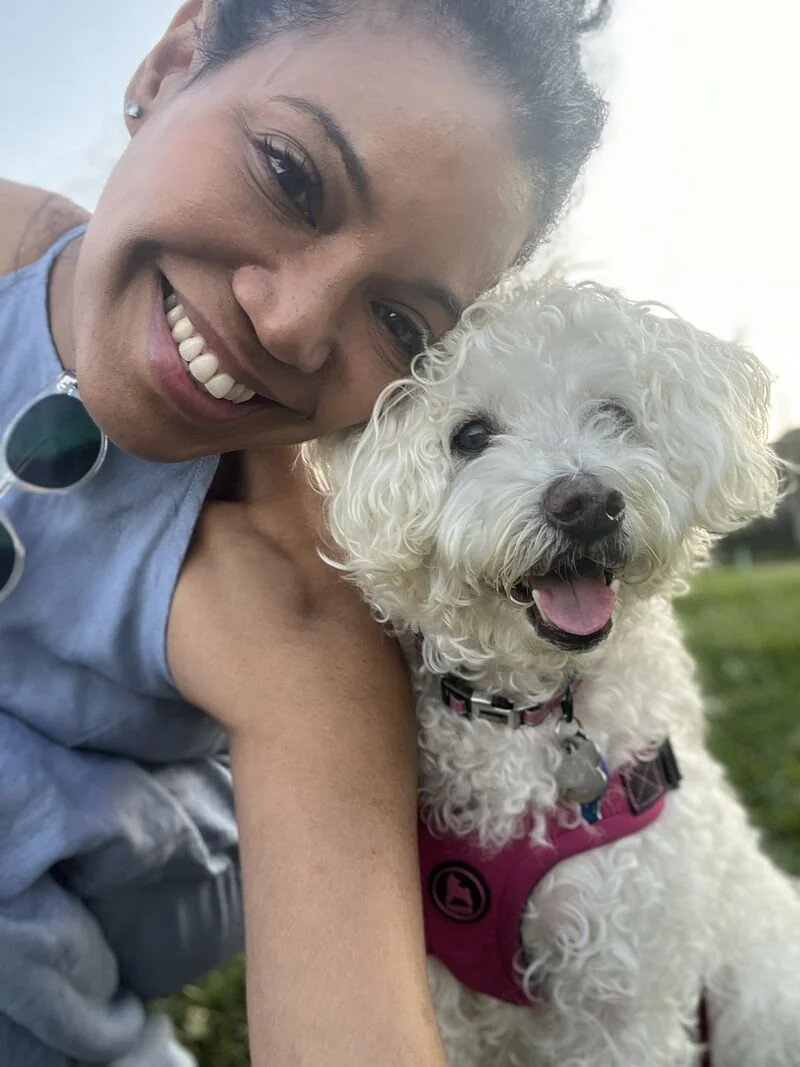 femi and her dog zooey smile into camera