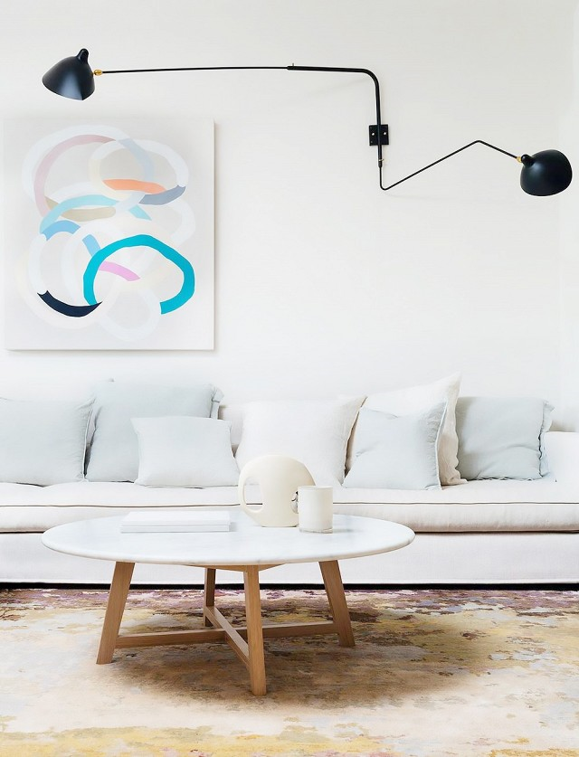 Arent&amp;Pyke via My Domaine The art in this living room space contrasts the otherwise very neutral palette.
