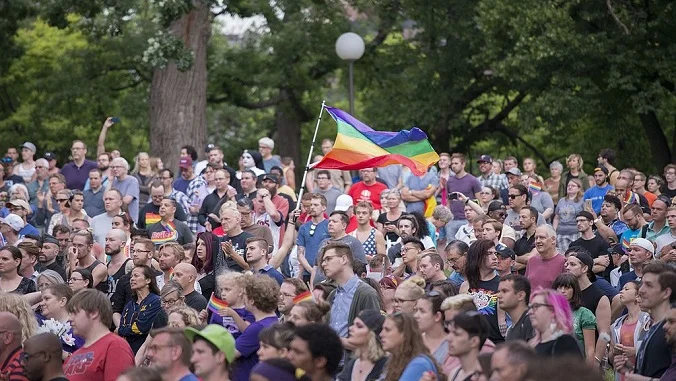Mourners gather for a vigil for the victims of the Orlando Shooting. Source.