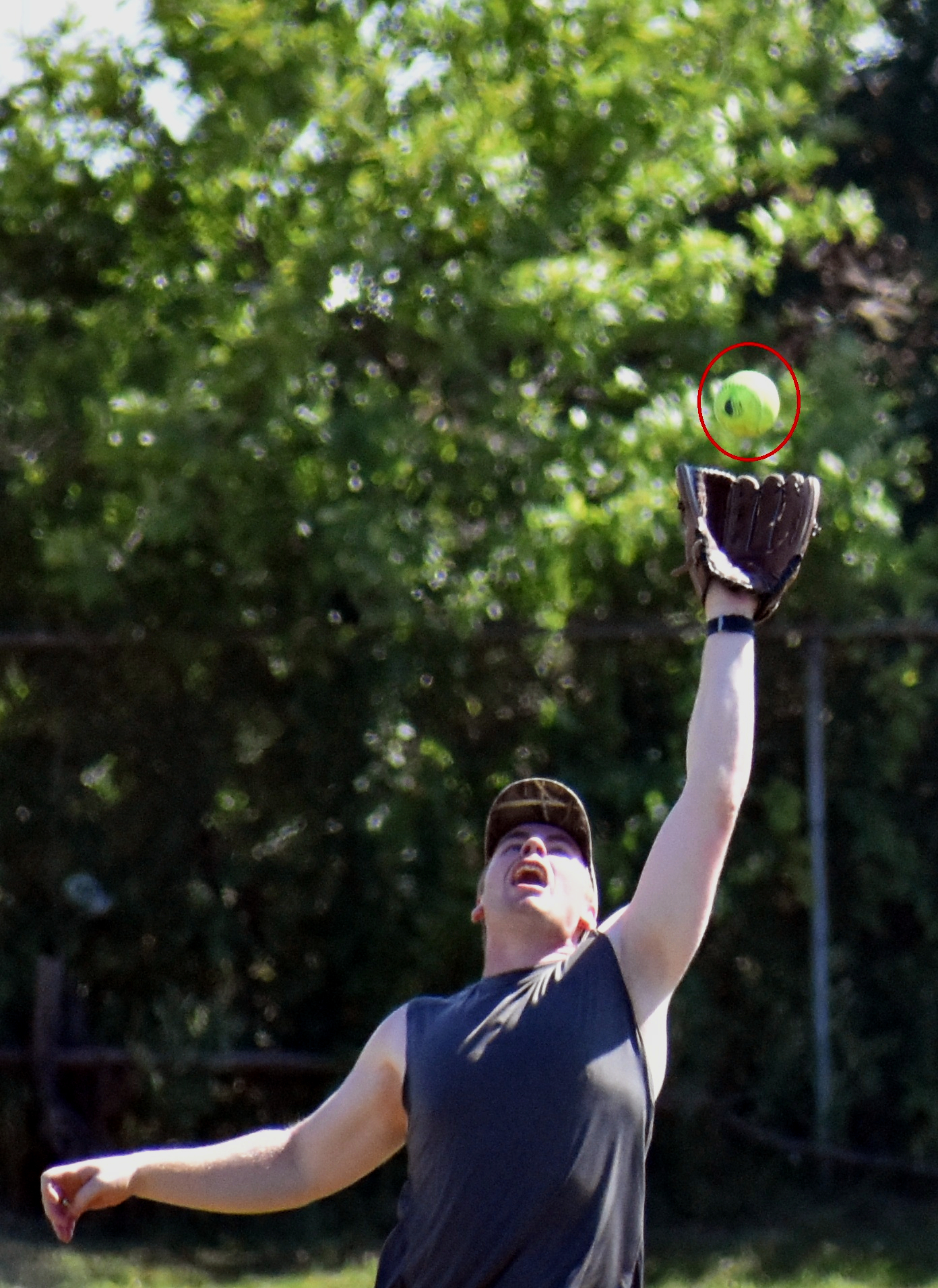  male player reaching to catch fly ball 