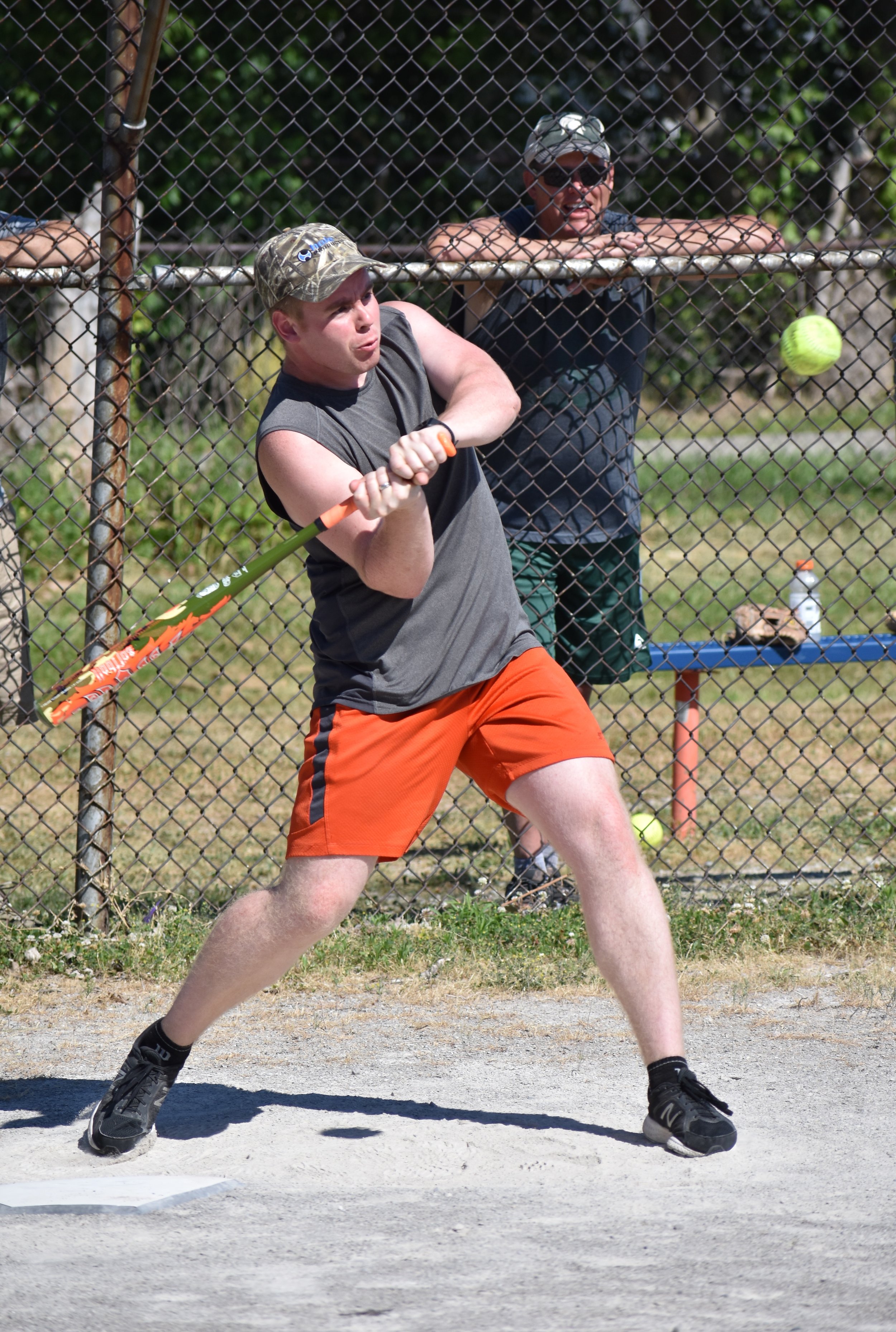  male player swinging at ball 