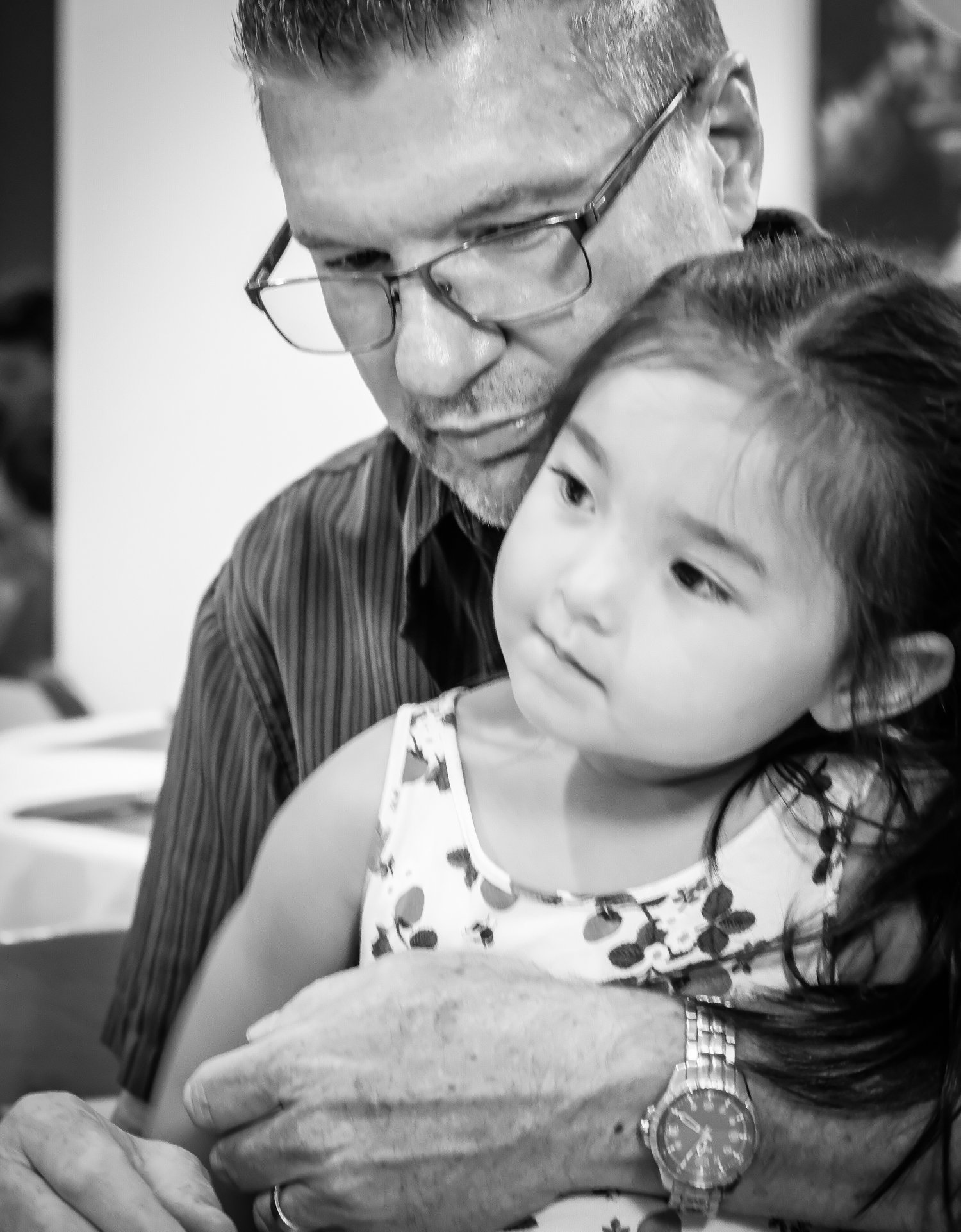  man holding grand-daughter black and white 