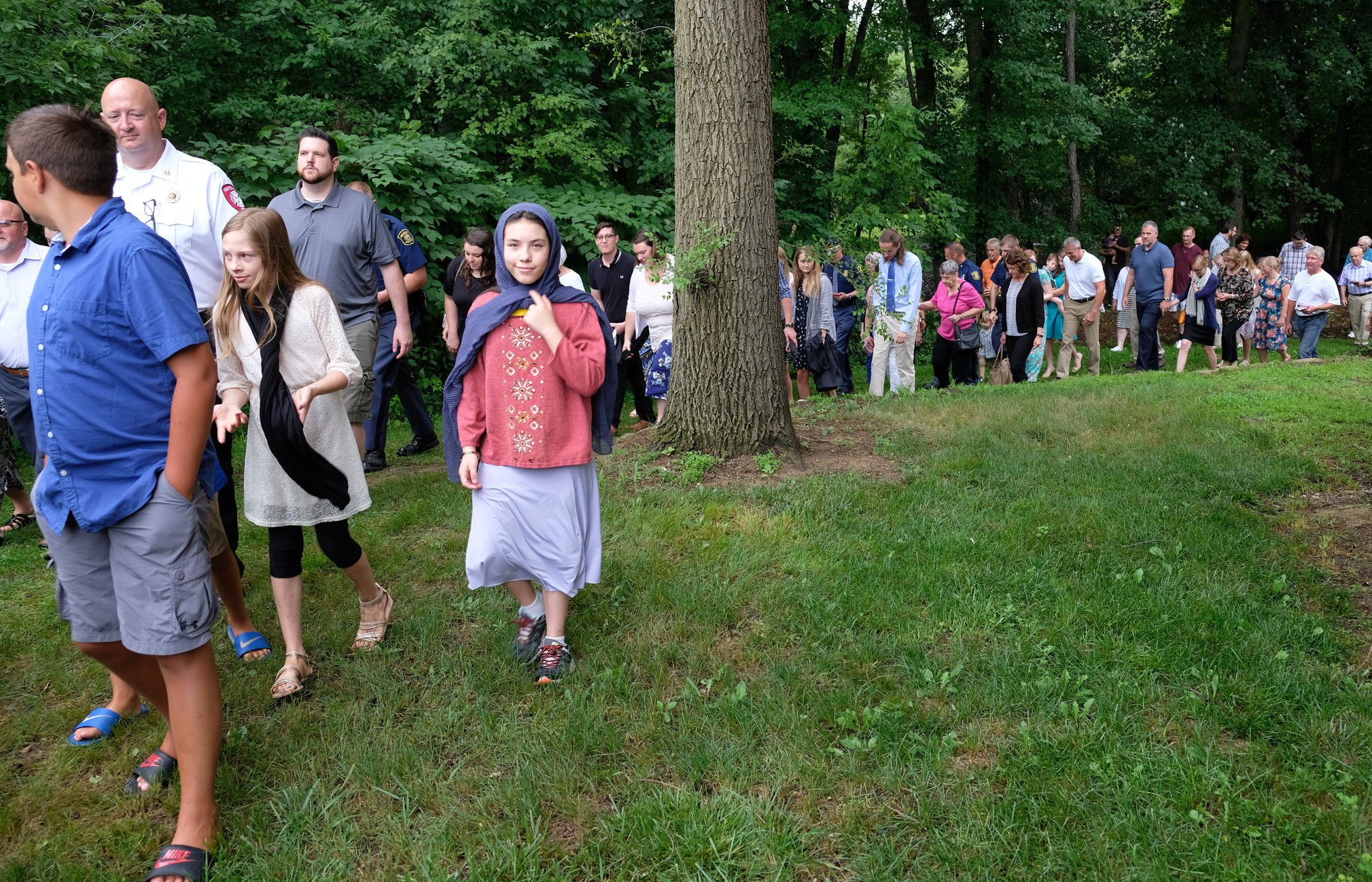 line of parishioners in outside procession