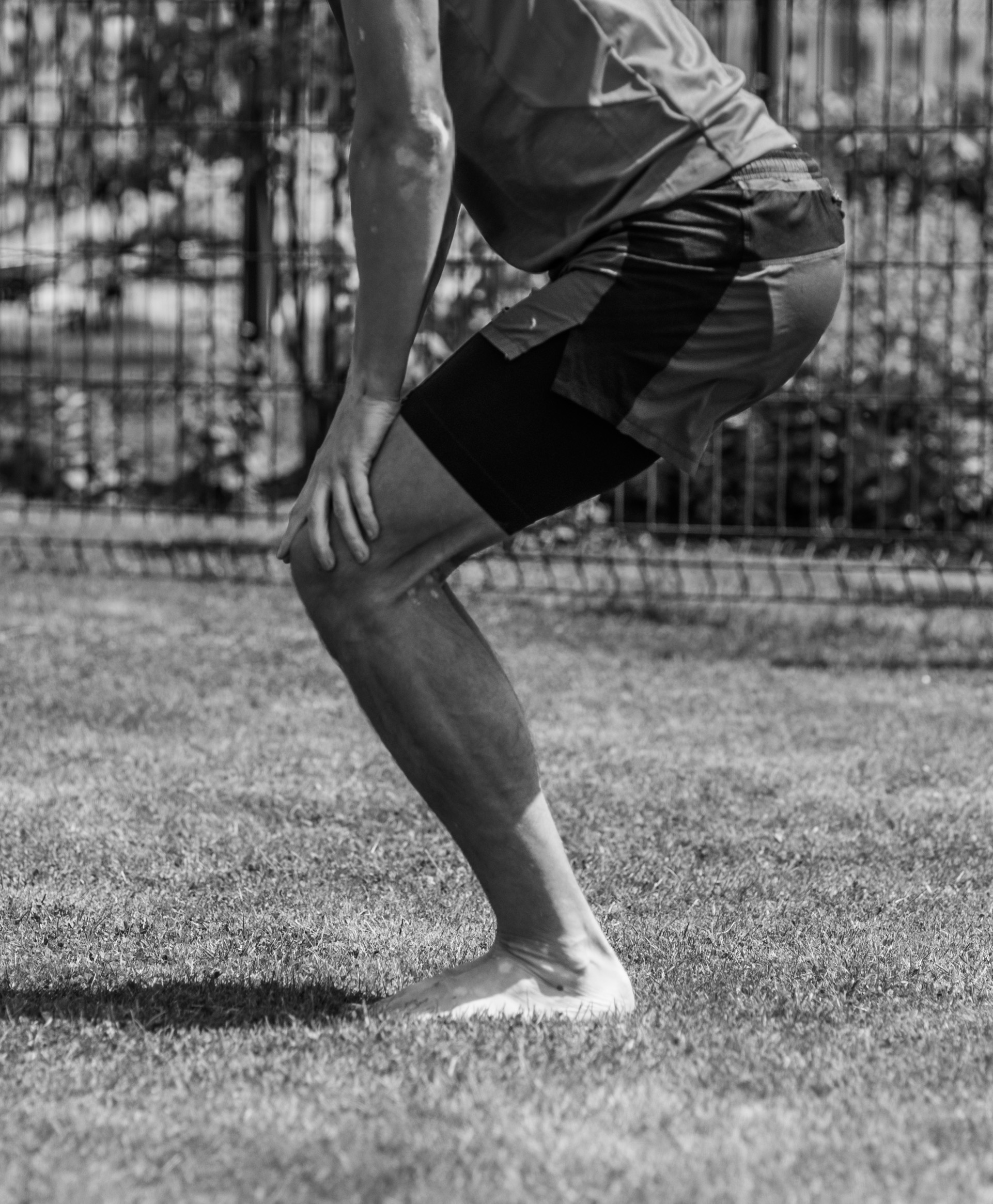 Simple test to assess flexibility of the Achilles tendon. With feet flat on the ground, knees should pass your toes