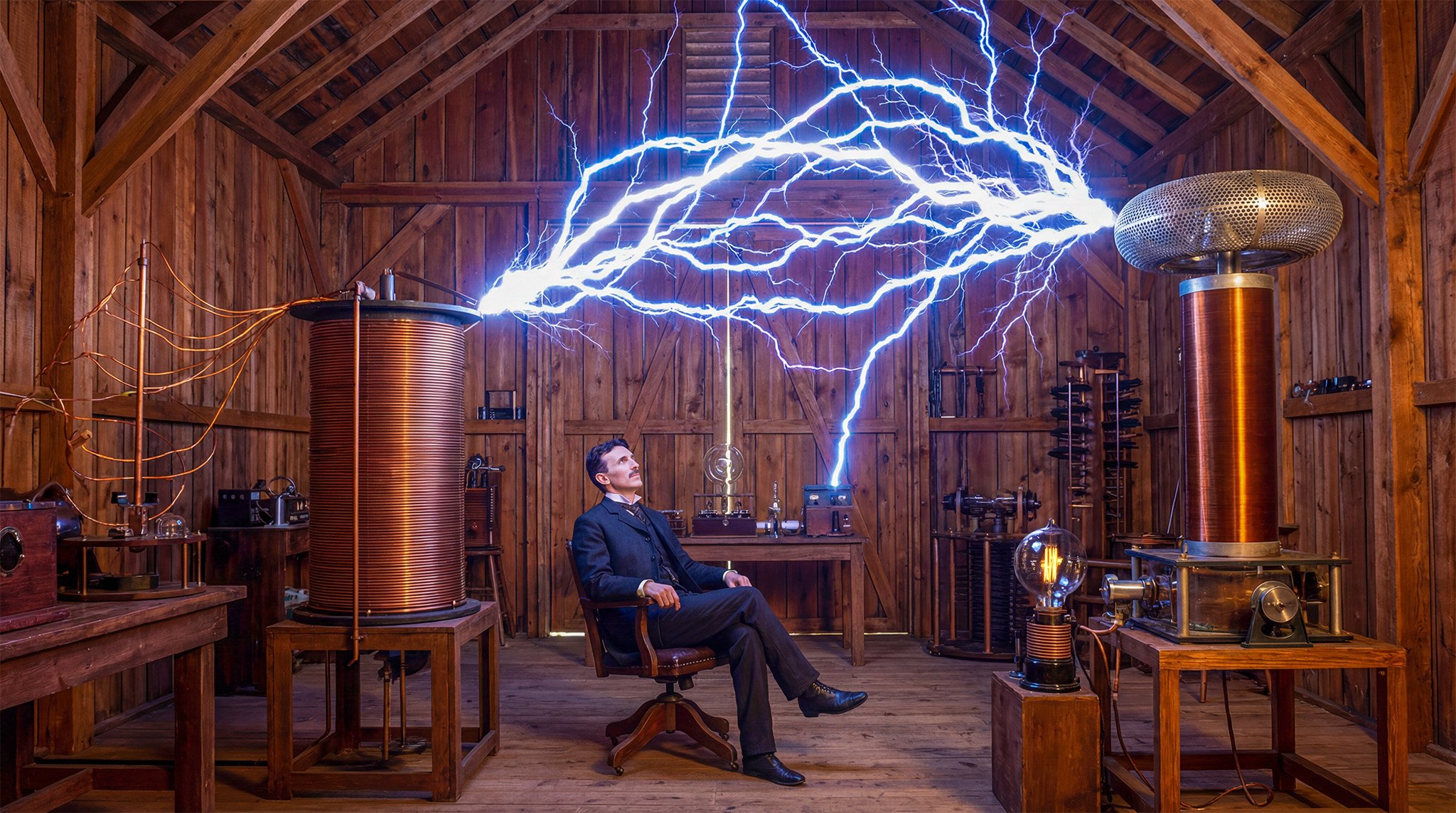 Nicola Tesla giving thought to the future of what might evolve from his inventions