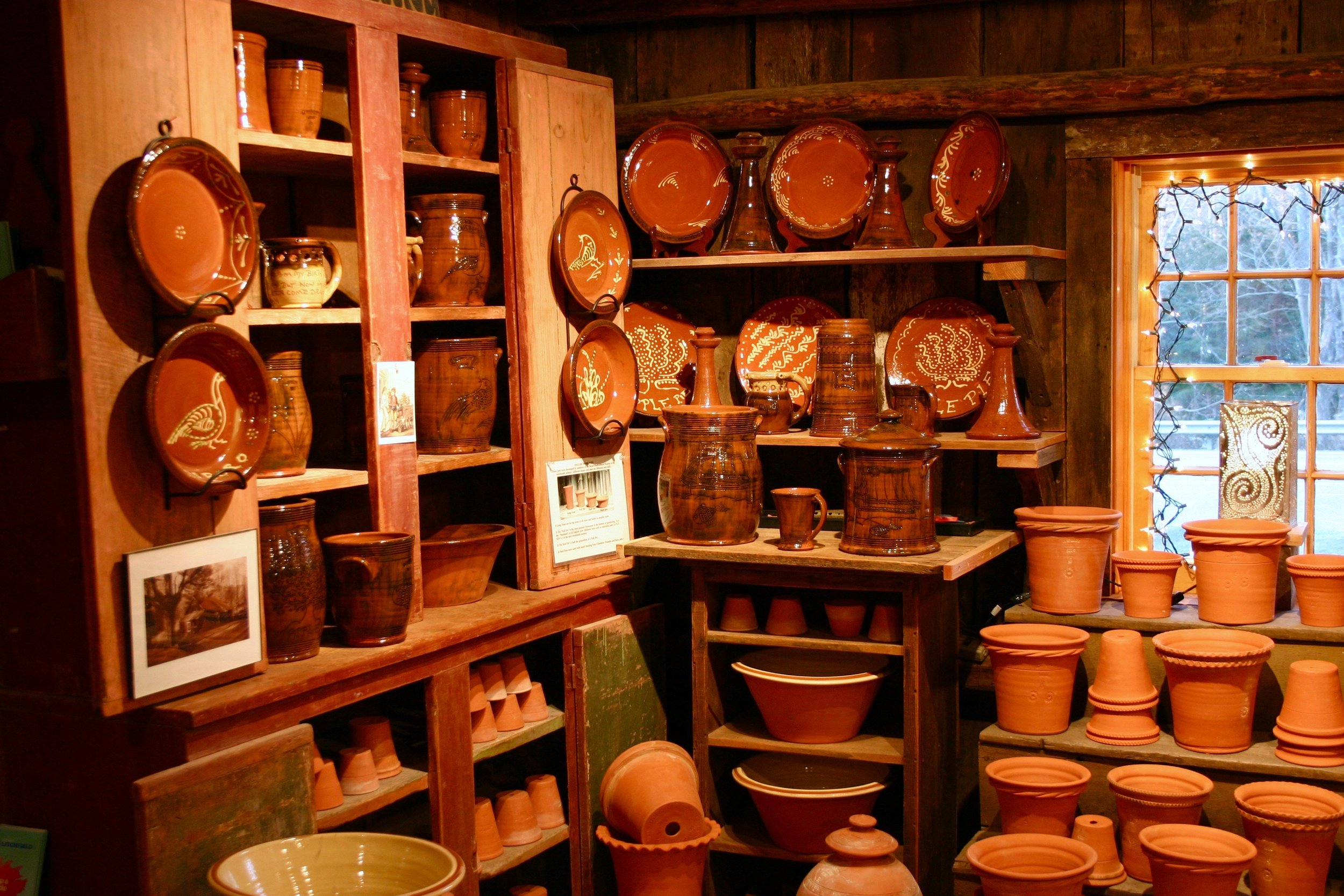 Redware pots in the shop today .