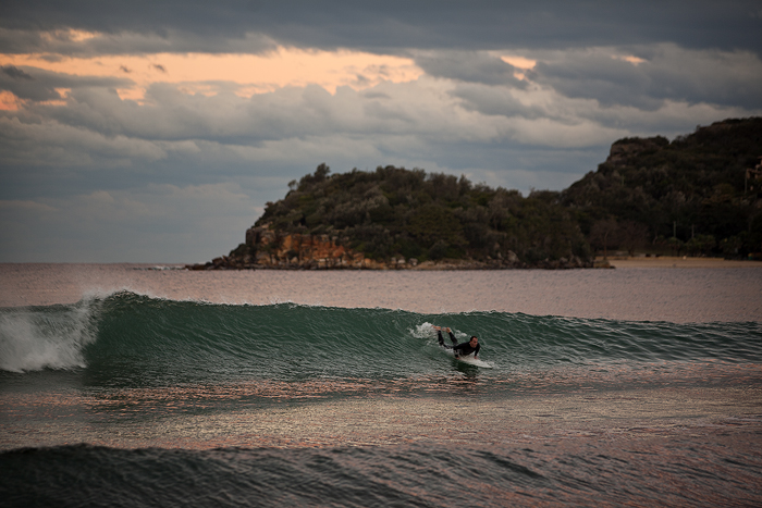 Surfer-catching-wave-on-Manly-Beach.jpg