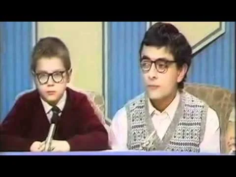 Rowan Atkinson and a little friend in the sketch: 'Ask the family'. 