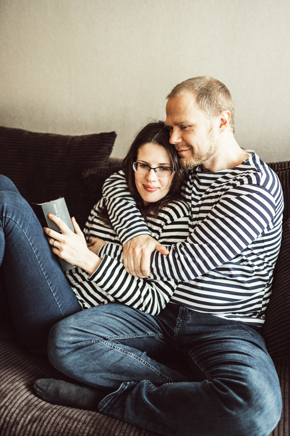 Beautiful couple embrasing at in-home photo session in Kuopio, Finland