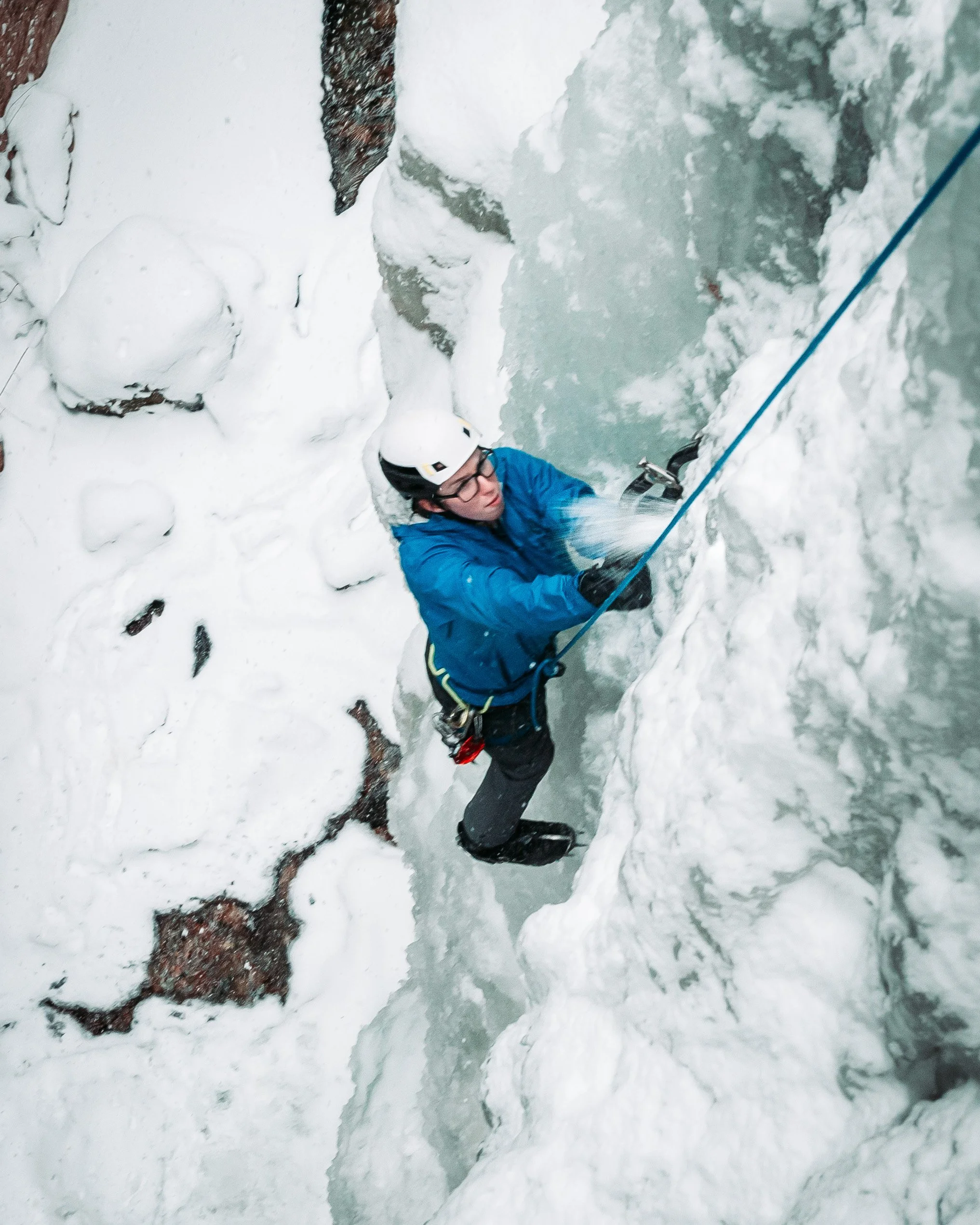Ascent Ice Climber climbing on frozen waterfall